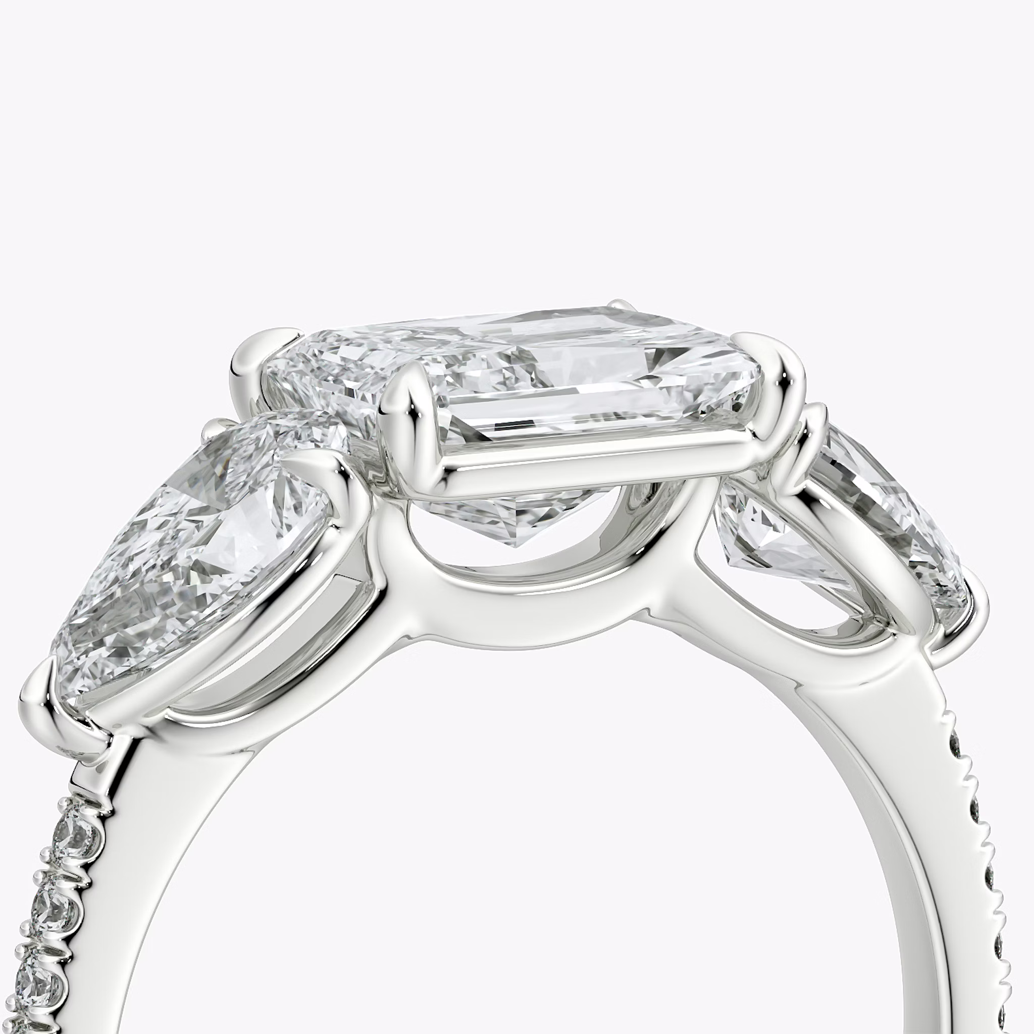The Three Stone | Radiant | Platinum | bandAccent: Pavé | diamondOrientation: horizontal | sideStoneCarat: 0.50ct | sideStoneShape: Pear | caratWeight: other