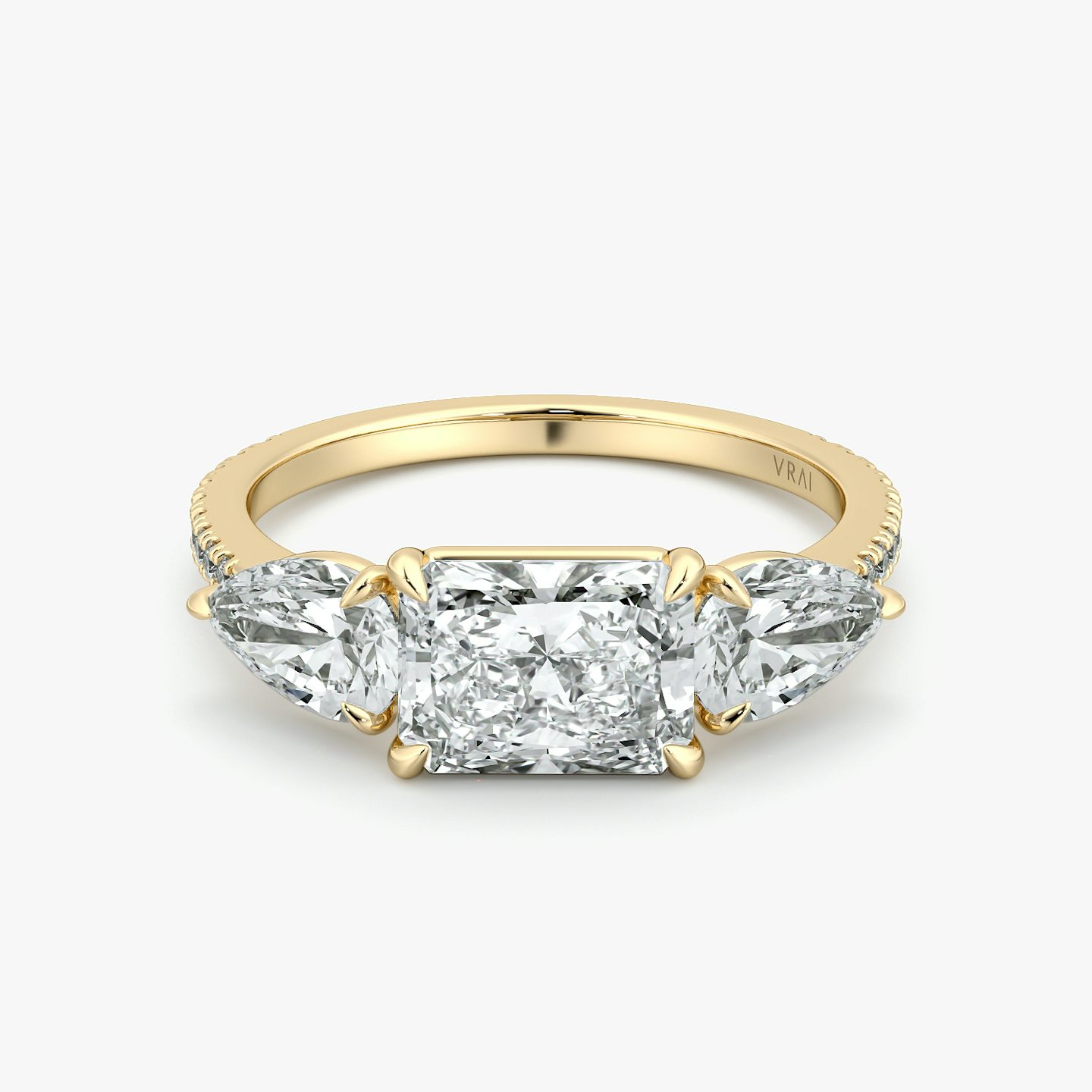 The Three Stone | Radiant | 18k | Yellow Gold | bandAccent: Pavé | diamondOrientation: horizontal | sideStoneCarat: 0.50ct | sideStoneShape: Pear | caratWeight: other