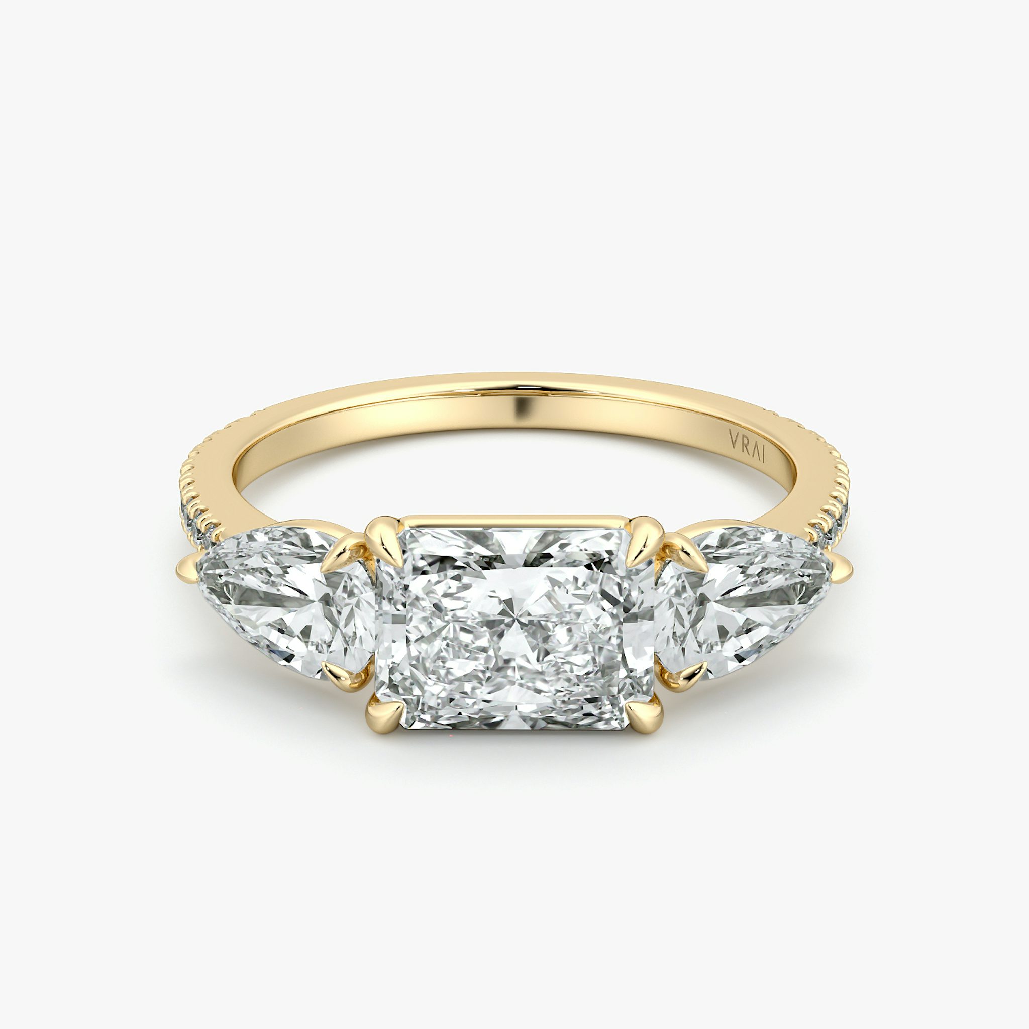The Three Stone | Radiant | 18k | Yellow Gold | bandAccent: Pavé | diamondOrientation: horizontal | sideStoneCarat: 0.50ct | sideStoneShape: Pear | caratWeight: other