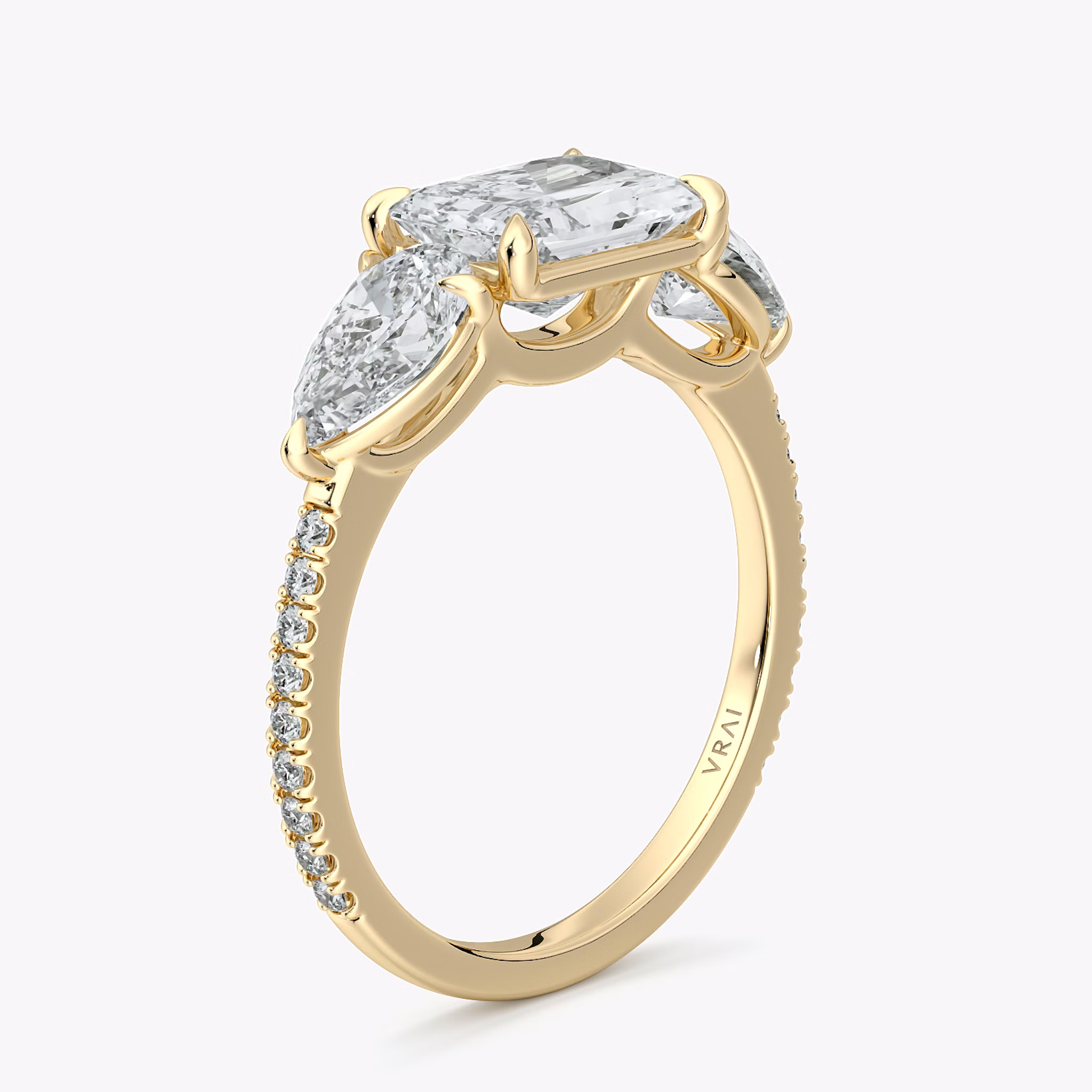 The Three Stone | Radiant | 18k | Yellow Gold | bandAccent: Pavé | diamondOrientation: horizontal | sideStoneCarat: 0.50ct | sideStoneShape: Pear | caratWeight: other