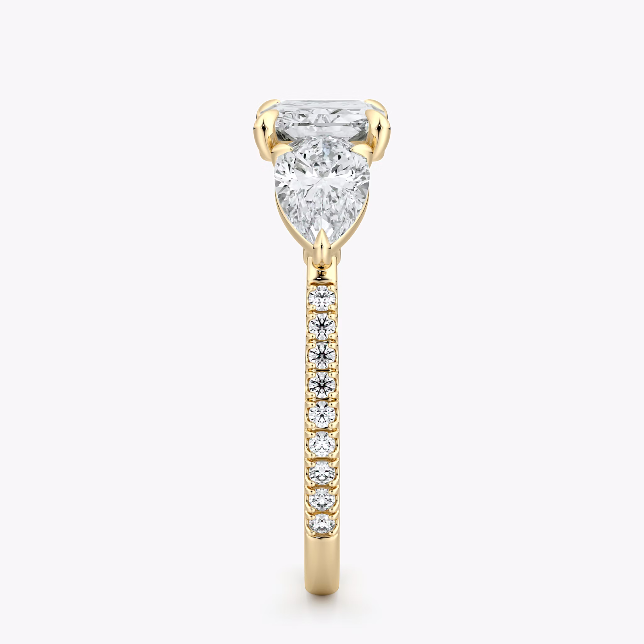 The Three Stone | Radiant | 18k | Yellow Gold | bandAccent: Pavé | diamondOrientation: horizontal | sideStoneCarat: 0.50ct | sideStoneShape: Pear | caratWeight: other
