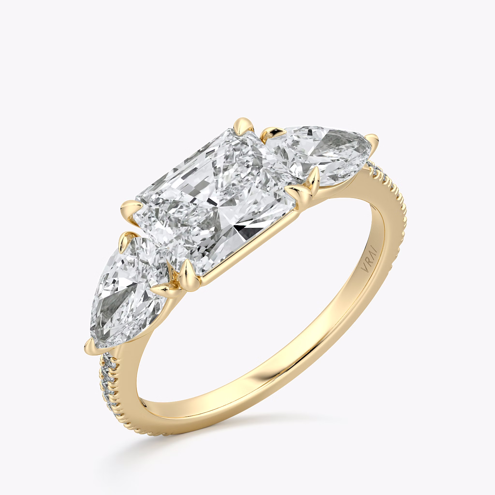 The Three Stone | Radiant | 18k | Yellow Gold | bandAccent: Pavé | diamondOrientation: horizontal | sideStoneCarat: 0.50ct | sideStoneShape: Pear | caratWeight: other