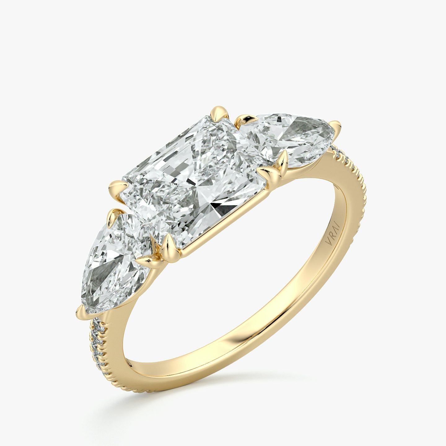 The Three Stone | Radiant | 18k | Yellow Gold | bandAccent: Pavé | diamondOrientation: horizontal | sideStoneCarat: 0.50ct | sideStoneShape: Pear | caratWeight: other