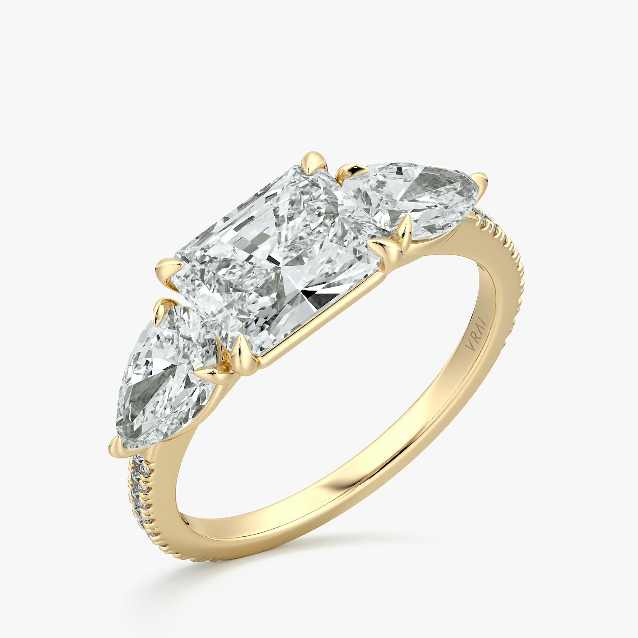 The Three Stone | Radiant | 18k | Yellow Gold | bandAccent: Pavé | diamondOrientation: horizontal | sideStoneCarat: 0.50ct | sideStoneShape: Pear | caratWeight: other