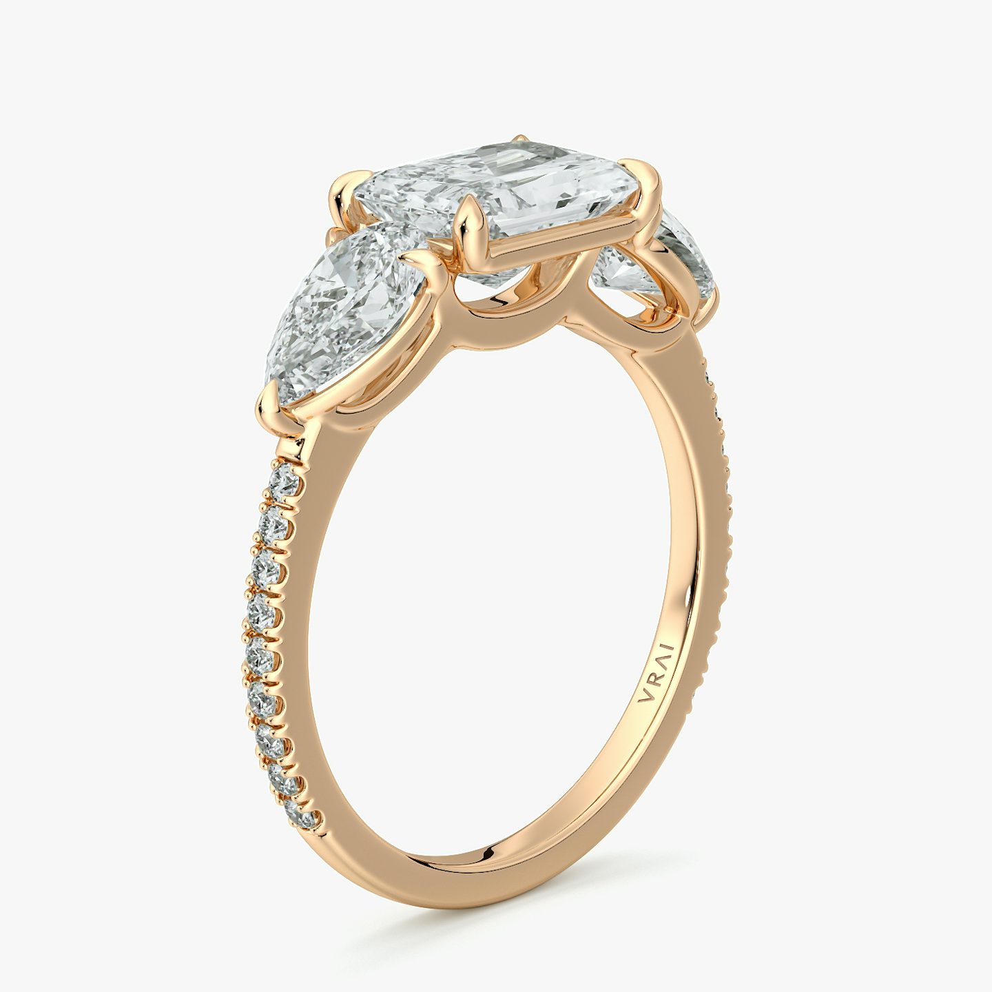 The Three Stone | Radiant | 14k | Rose Gold | bandAccent: Pavé | diamondOrientation: horizontal | sideStoneCarat: 0.50ct | sideStoneShape: Pear | caratWeight: other