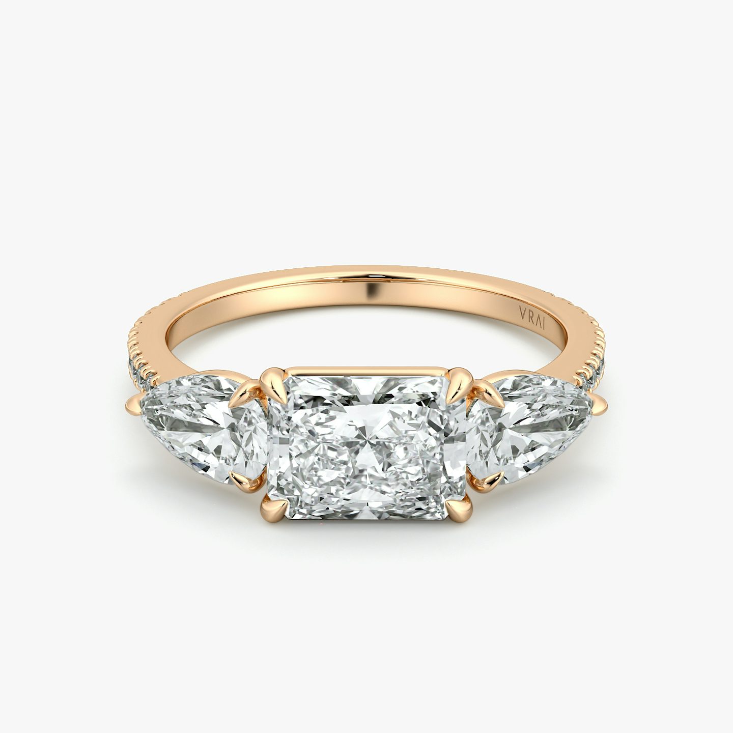 The Three Stone | Radiant | 14k | Rose Gold | bandAccent: Pavé | diamondOrientation: horizontal | sideStoneCarat: 0.50ct | sideStoneShape: Pear | caratWeight: other