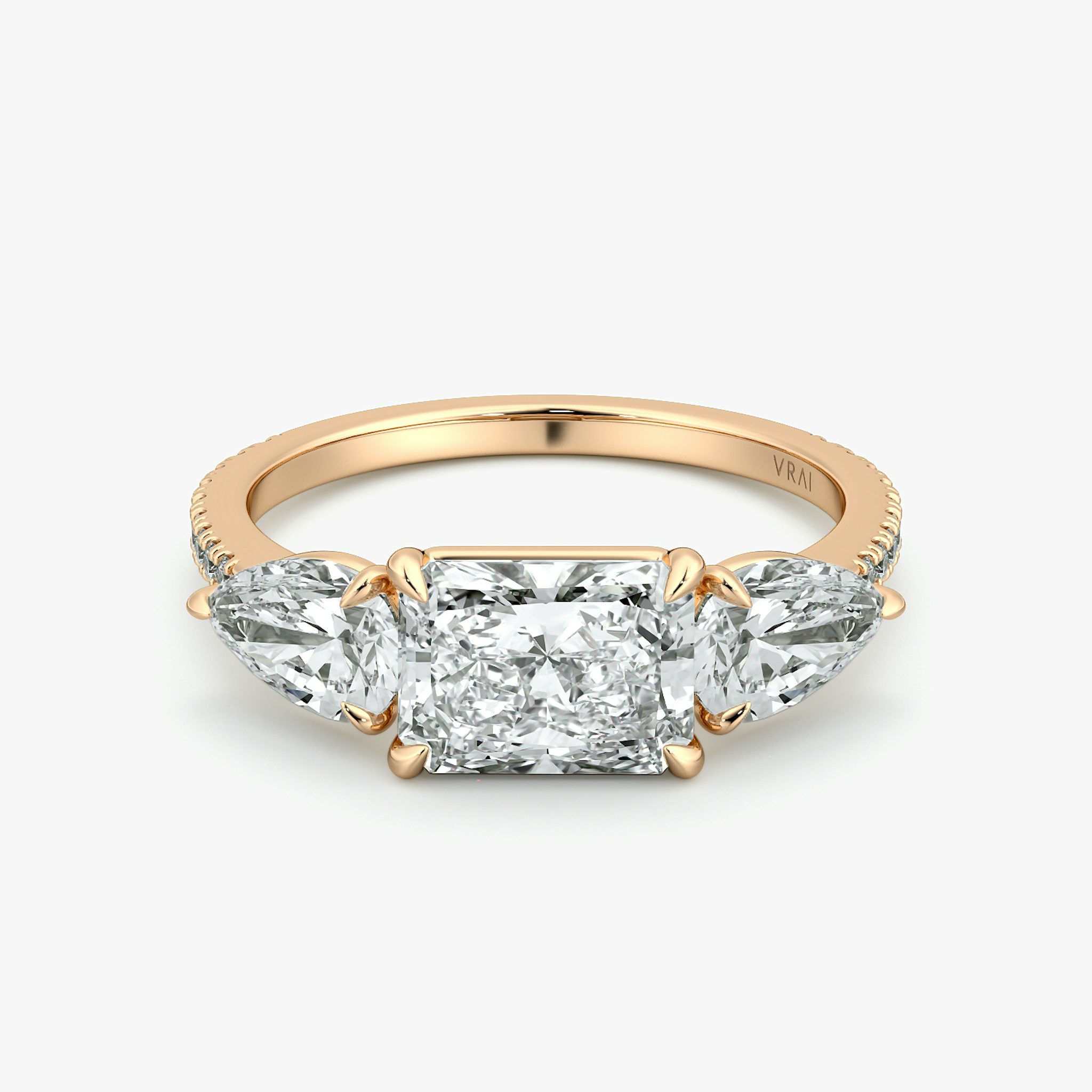The Three Stone | Radiant | 14k | Rose Gold | bandAccent: Pavé | diamondOrientation: horizontal | sideStoneCarat: 0.50ct | sideStoneShape: Pear | caratWeight: other