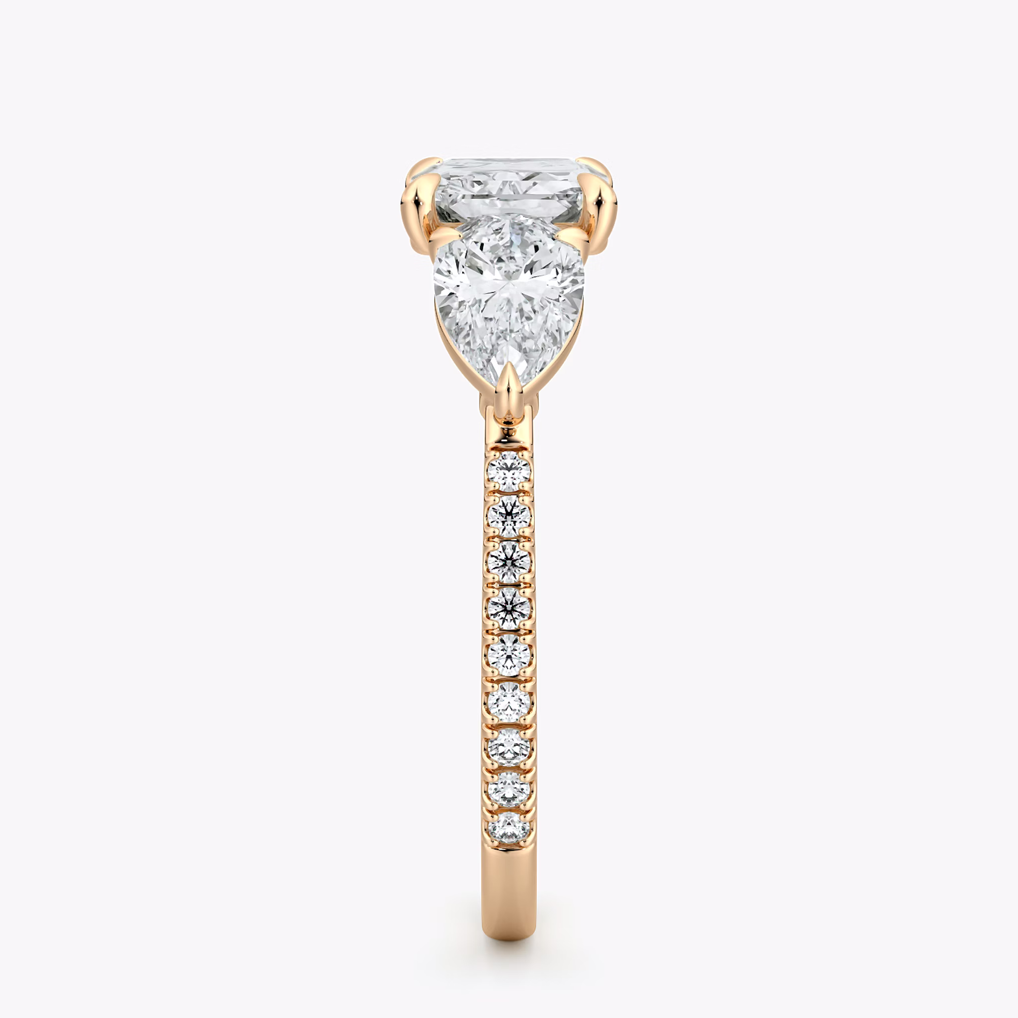 The Three Stone | Radiant | 14k | Rose Gold | bandAccent: Pavé | diamondOrientation: horizontal | sideStoneCarat: 0.50ct | sideStoneShape: Pear | caratWeight: other