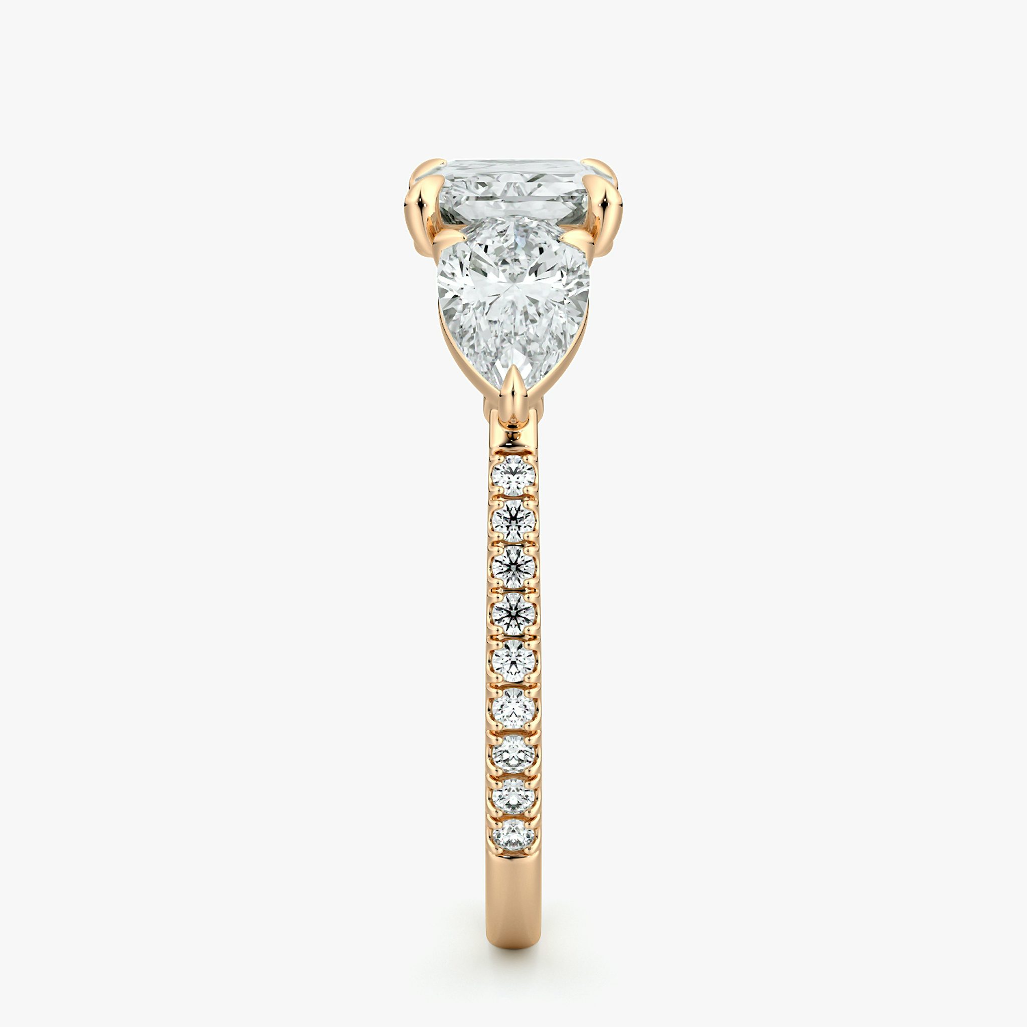 The Three Stone | Radiant | 14k | Rose Gold | bandAccent: Pavé | diamondOrientation: horizontal | sideStoneCarat: 0.50ct | sideStoneShape: Pear | caratWeight: other