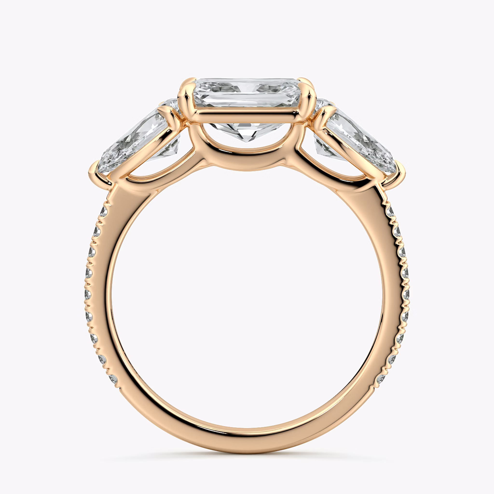 The Three Stone | Radiant | 14k | Rose Gold | bandAccent: Pavé | diamondOrientation: horizontal | sideStoneCarat: 0.50ct | sideStoneShape: Pear | caratWeight: other
