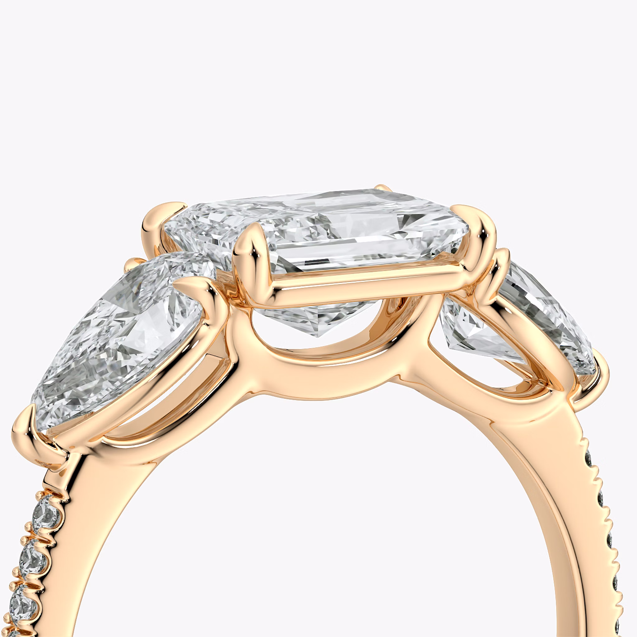 The Three Stone | Radiant | 14k | Rose Gold | bandAccent: Pavé | diamondOrientation: horizontal | sideStoneCarat: 0.50ct | sideStoneShape: Pear | caratWeight: other