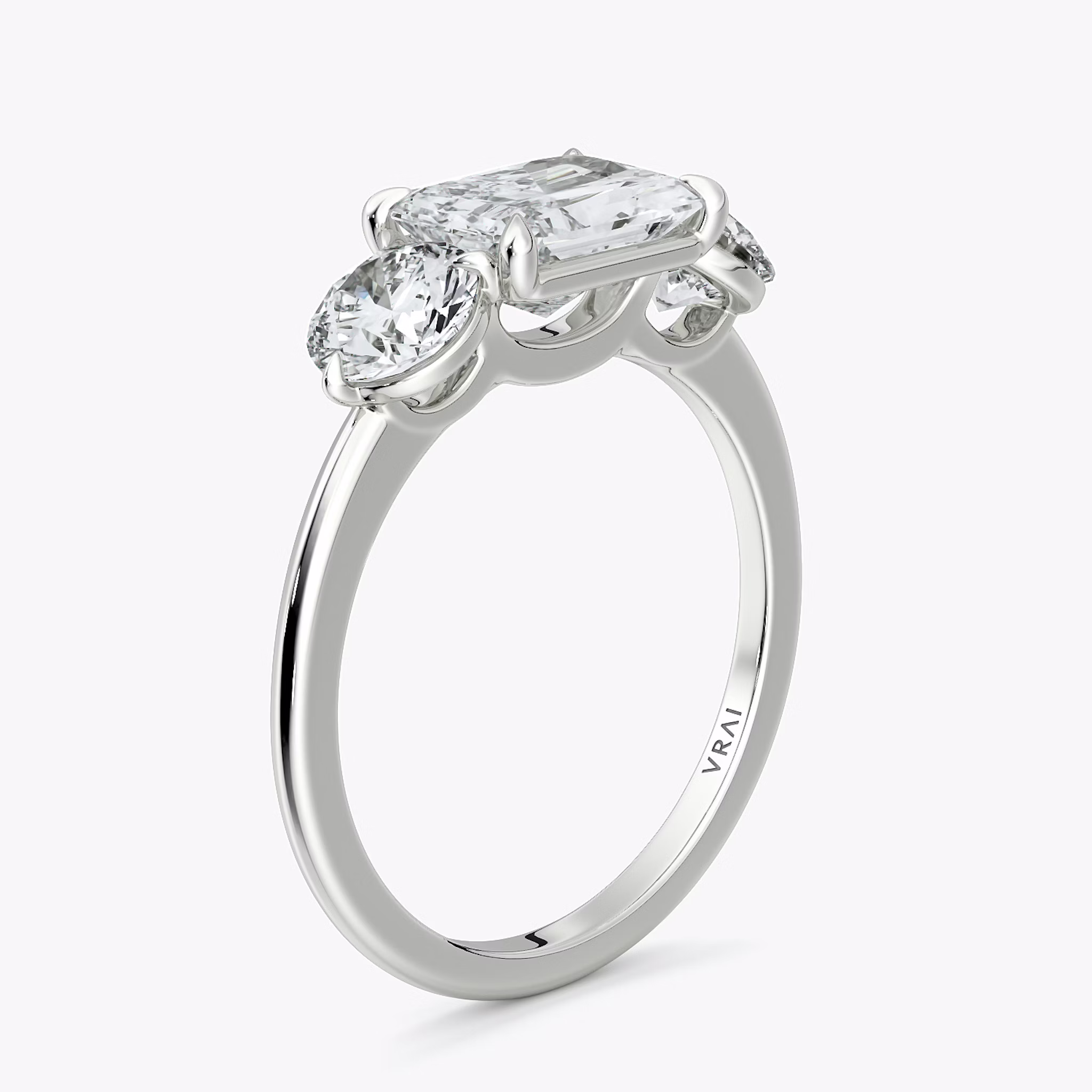 The Three Stone | Radiant | 18k | White Gold | bandAccent: Plain | diamondOrientation: horizontal | sideStoneCarat: 0.50ct | sideStoneShape: Round Brilliant | caratWeight: other