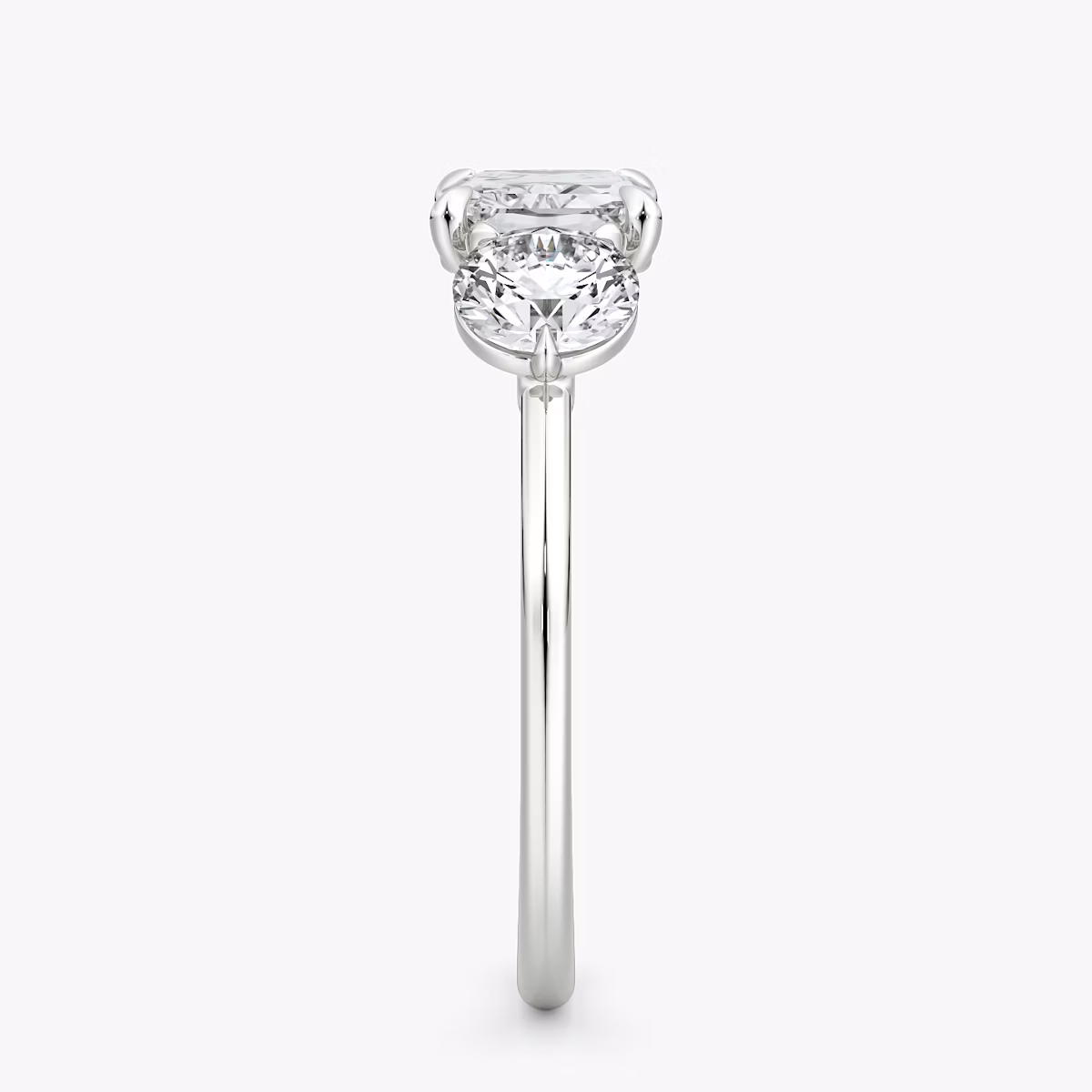 The Three Stone | Radiant | 18k | White Gold | bandAccent: Plain | diamondOrientation: horizontal | sideStoneCarat: 0.50ct | sideStoneShape: Round Brilliant | caratWeight: other