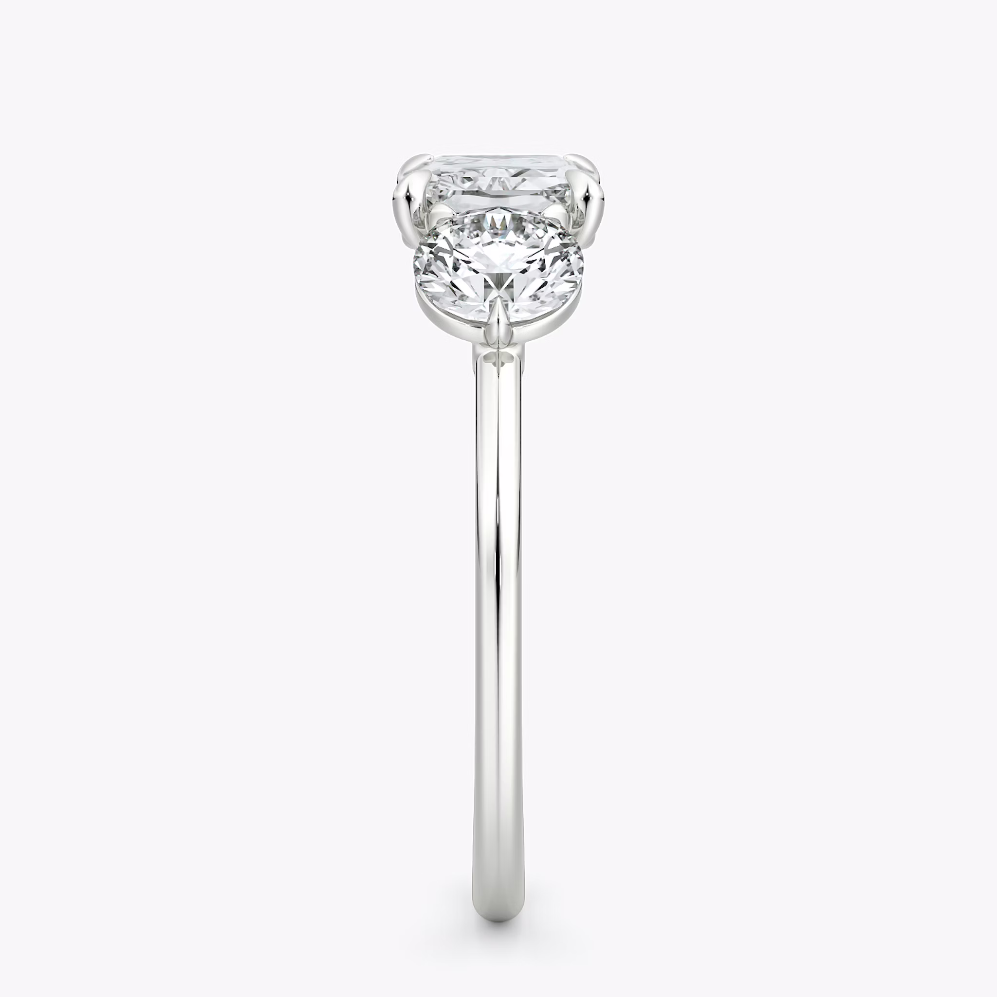The Three Stone | Radiant | 18k | White Gold | bandAccent: Plain | diamondOrientation: horizontal | sideStoneCarat: 0.50ct | sideStoneShape: Round Brilliant | caratWeight: other