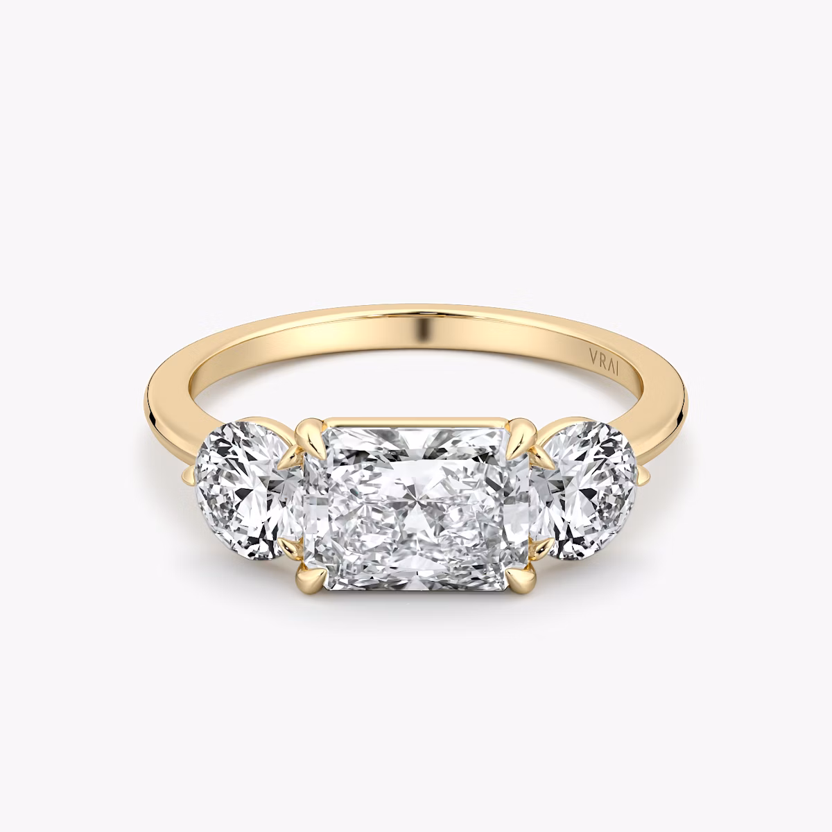 The Three Stone | Radiant | 18k | Yellow Gold | bandAccent: Plain | diamondOrientation: horizontal | sideStoneCarat: 0.50ct | sideStoneShape: Round Brilliant | caratWeight: other