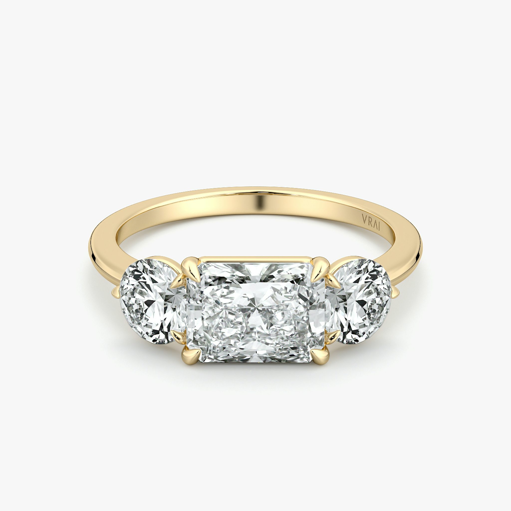 The Three Stone | Radiant | 18k | Yellow Gold | bandAccent: Plain | diamondOrientation: horizontal | sideStoneCarat: 0.50ct | sideStoneShape: Round Brilliant | caratWeight: other