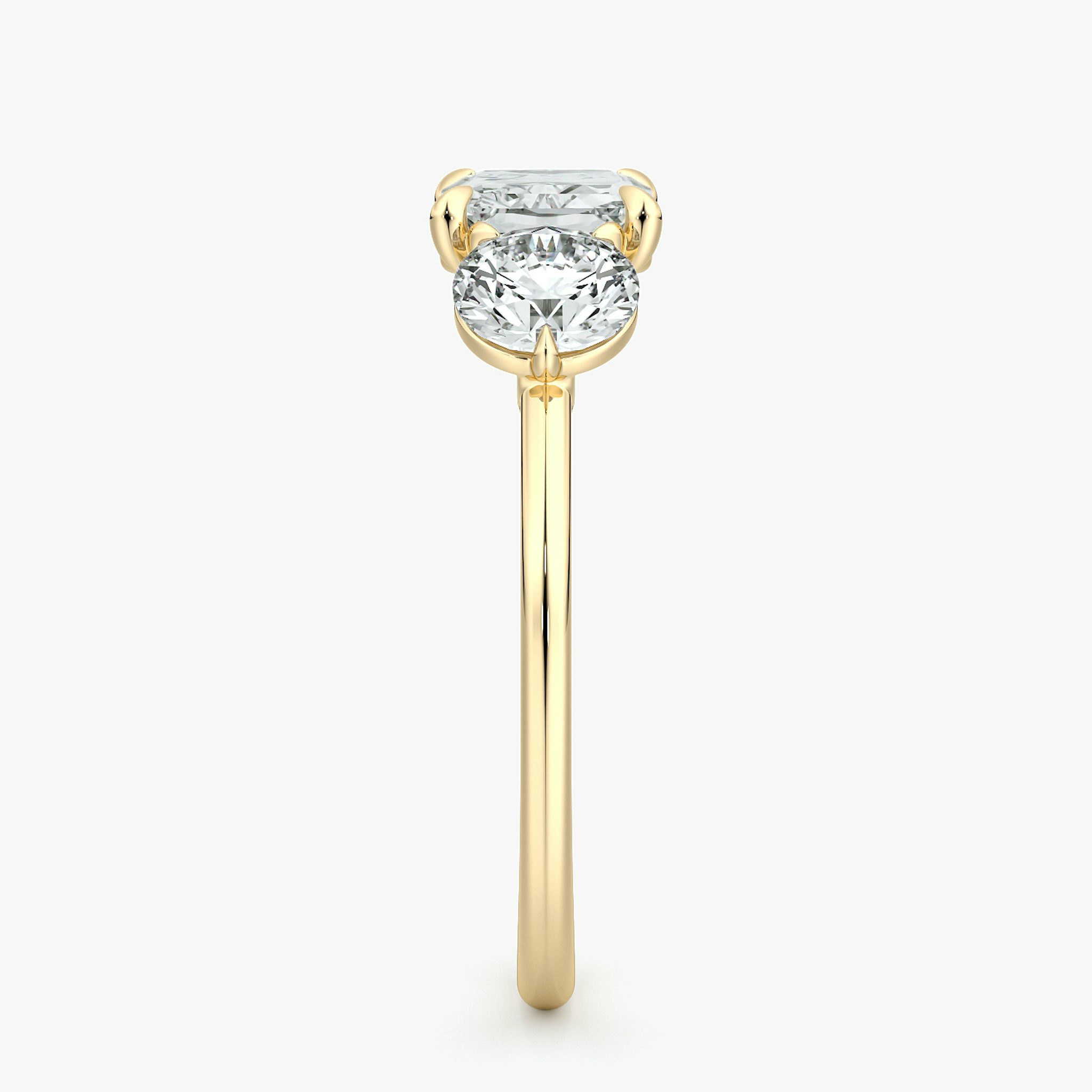 The Three Stone | Radiant | 18k | Yellow Gold | bandAccent: Plain | diamondOrientation: horizontal | sideStoneCarat: 0.50ct | sideStoneShape: Round Brilliant | caratWeight: other
