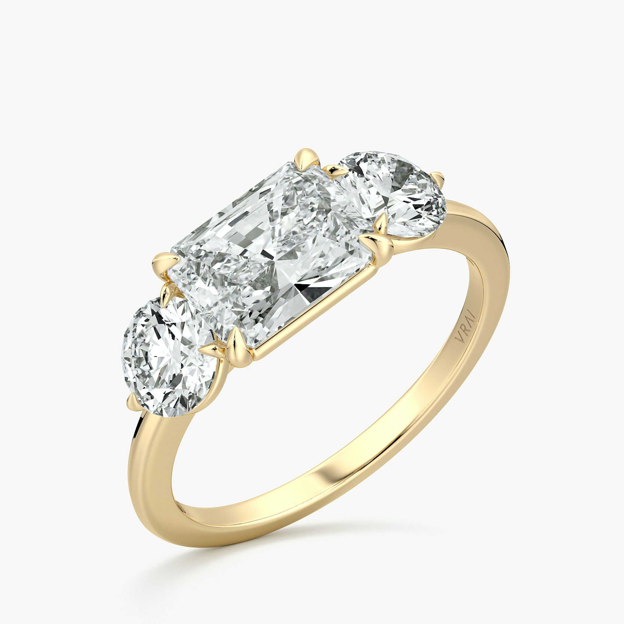 The Three Stone | Radiant | 18k | Yellow Gold | bandAccent: Plain | diamondOrientation: horizontal | sideStoneCarat: 0.50ct | sideStoneShape: Round Brilliant | caratWeight: other