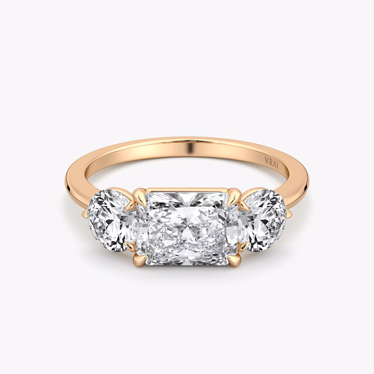 The Three Stone | Radiant | 14k | Rose Gold | bandAccent: Plain | diamondOrientation: horizontal | sideStoneCarat: 0.50ct | sideStoneShape: Round Brilliant | caratWeight: other