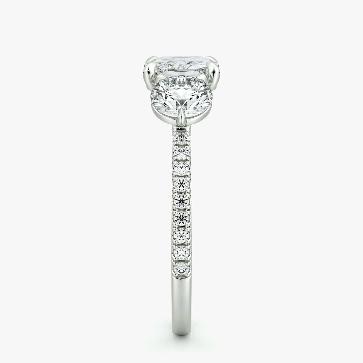 The Three Stone | Radiant | 18k | White Gold | bandAccent: Pavé | diamondOrientation: horizontal | sideStoneCarat: 0.50ct | sideStoneShape: Round Brilliant | caratWeight: other