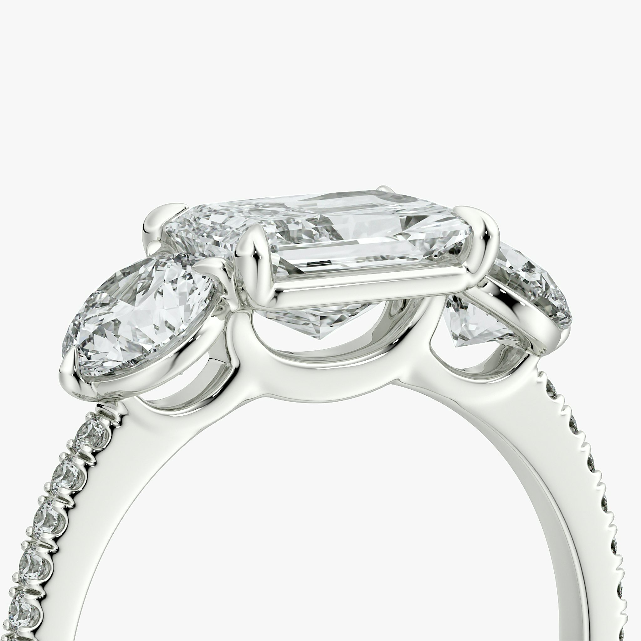The Three Stone | Radiant | 18k | White Gold | bandAccent: Pavé | diamondOrientation: horizontal | sideStoneCarat: 0.50ct | sideStoneShape: Round Brilliant | caratWeight: other