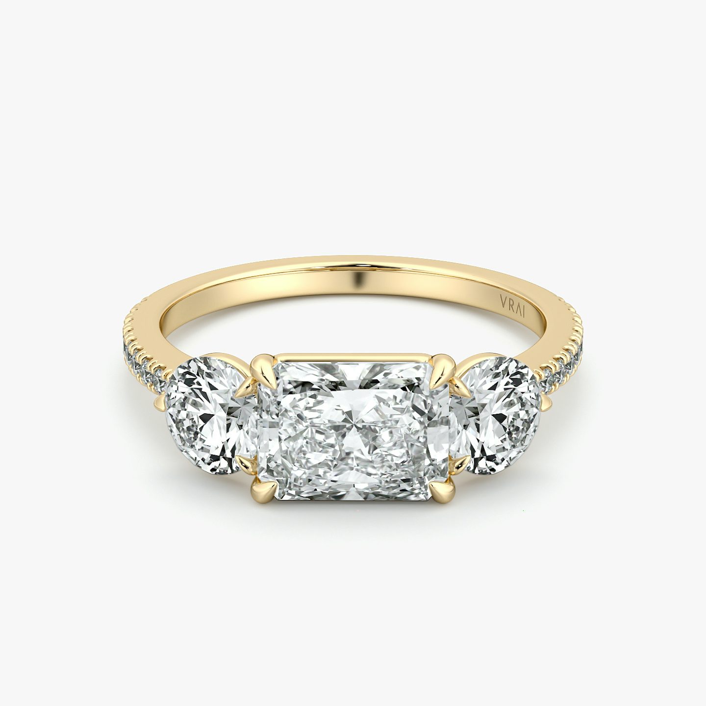 The Three Stone | Radiant | 18k | Yellow Gold | bandAccent: Pavé | diamondOrientation: horizontal | sideStoneCarat: 0.50ct | sideStoneShape: Round Brilliant | caratWeight: other