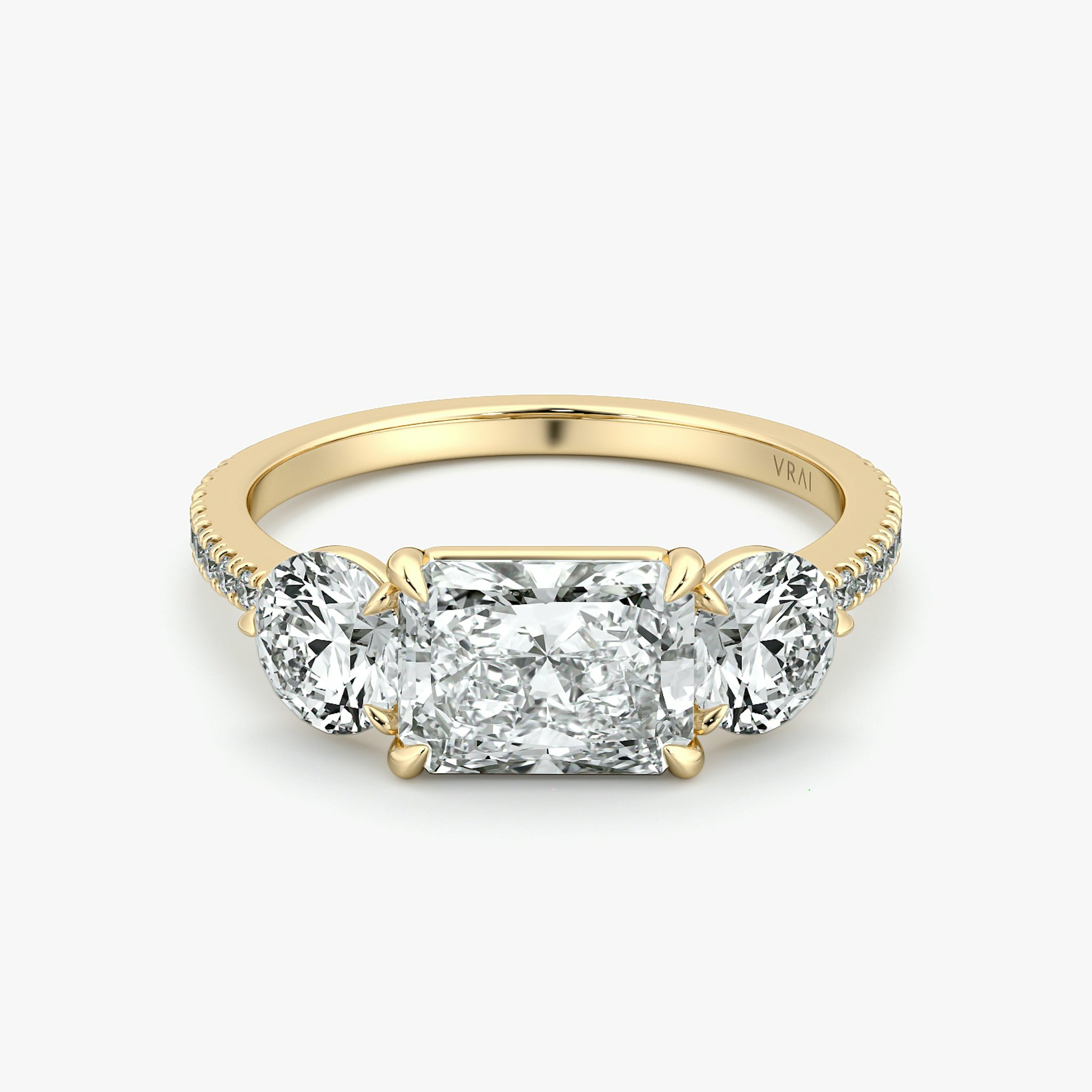 The Three Stone | Radiant | 18k | Yellow Gold | bandAccent: Pavé | diamondOrientation: horizontal | sideStoneCarat: 0.50ct | sideStoneShape: Round Brilliant | caratWeight: other