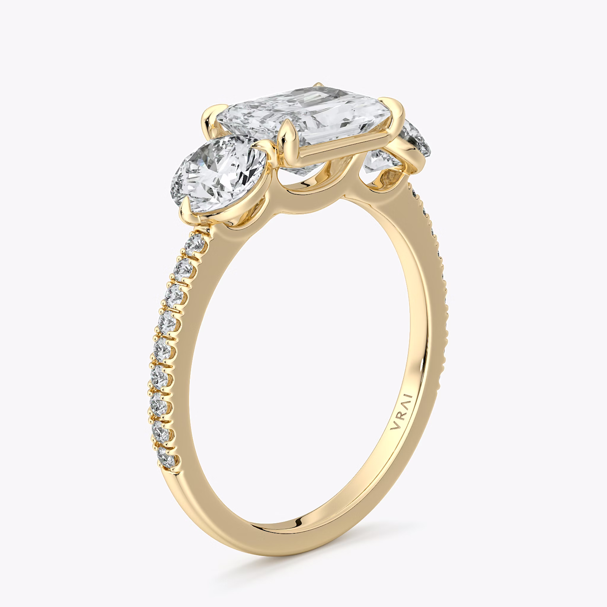 The Three Stone | Radiant | 18k | Yellow Gold | bandAccent: Pavé | diamondOrientation: horizontal | sideStoneCarat: 0.50ct | sideStoneShape: Round Brilliant | caratWeight: other