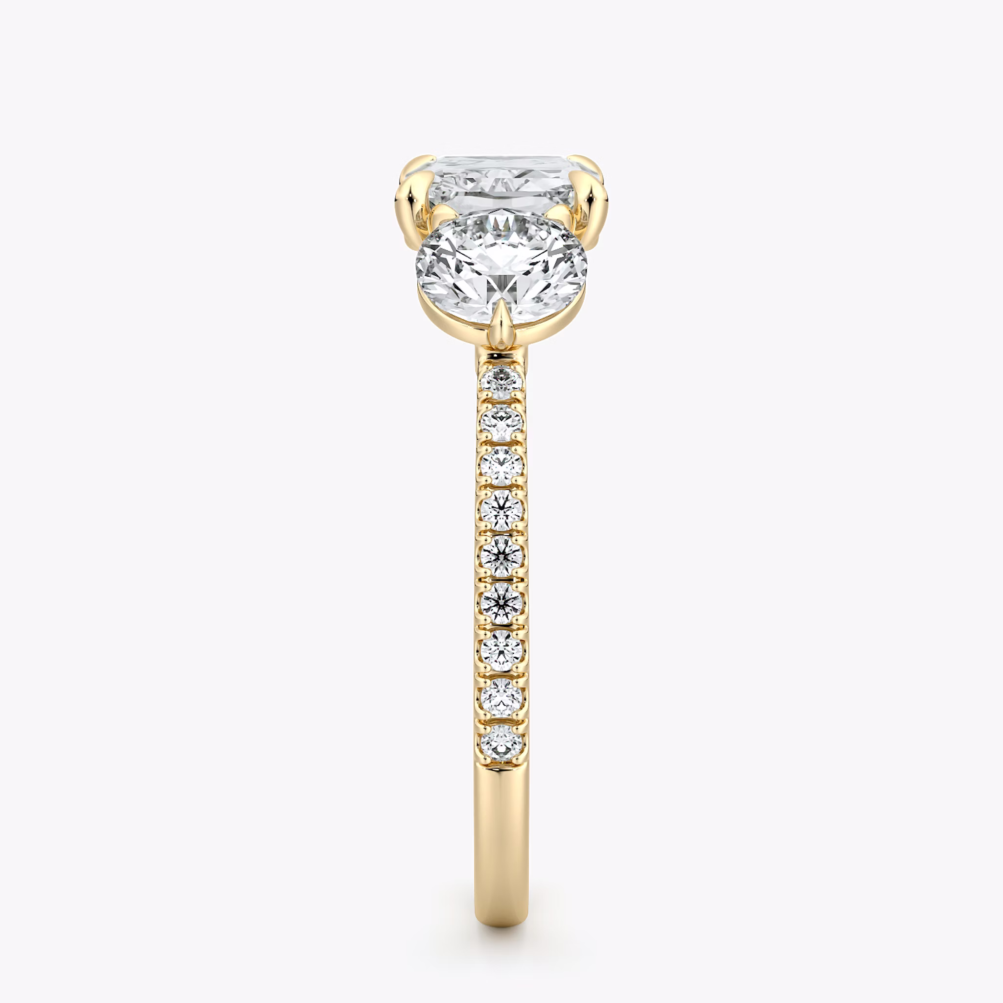 The Three Stone | Radiant | 18k | Yellow Gold | bandAccent: Pavé | diamondOrientation: horizontal | sideStoneCarat: 0.50ct | sideStoneShape: Round Brilliant | caratWeight: other