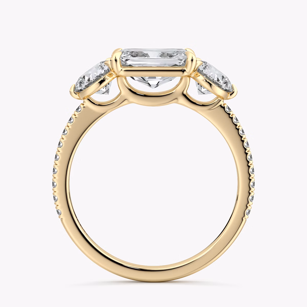 The Three Stone | Radiant | 18k | Yellow Gold | bandAccent: Pavé | diamondOrientation: horizontal | sideStoneCarat: 0.50ct | sideStoneShape: Round Brilliant | caratWeight: other