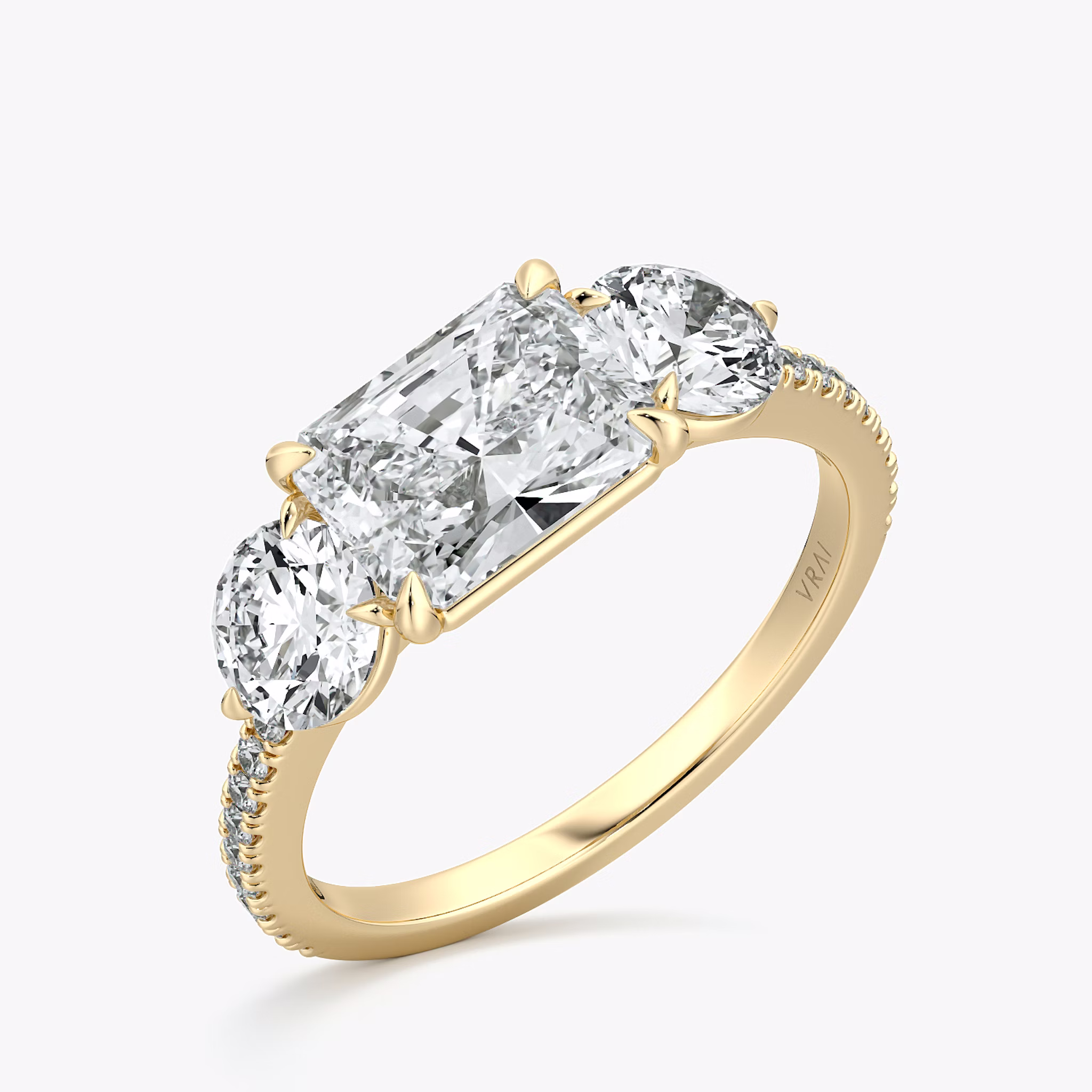 The Three Stone | Radiant | 18k | Yellow Gold | bandAccent: Pavé | diamondOrientation: horizontal | sideStoneCarat: 0.50ct | sideStoneShape: Round Brilliant | caratWeight: other