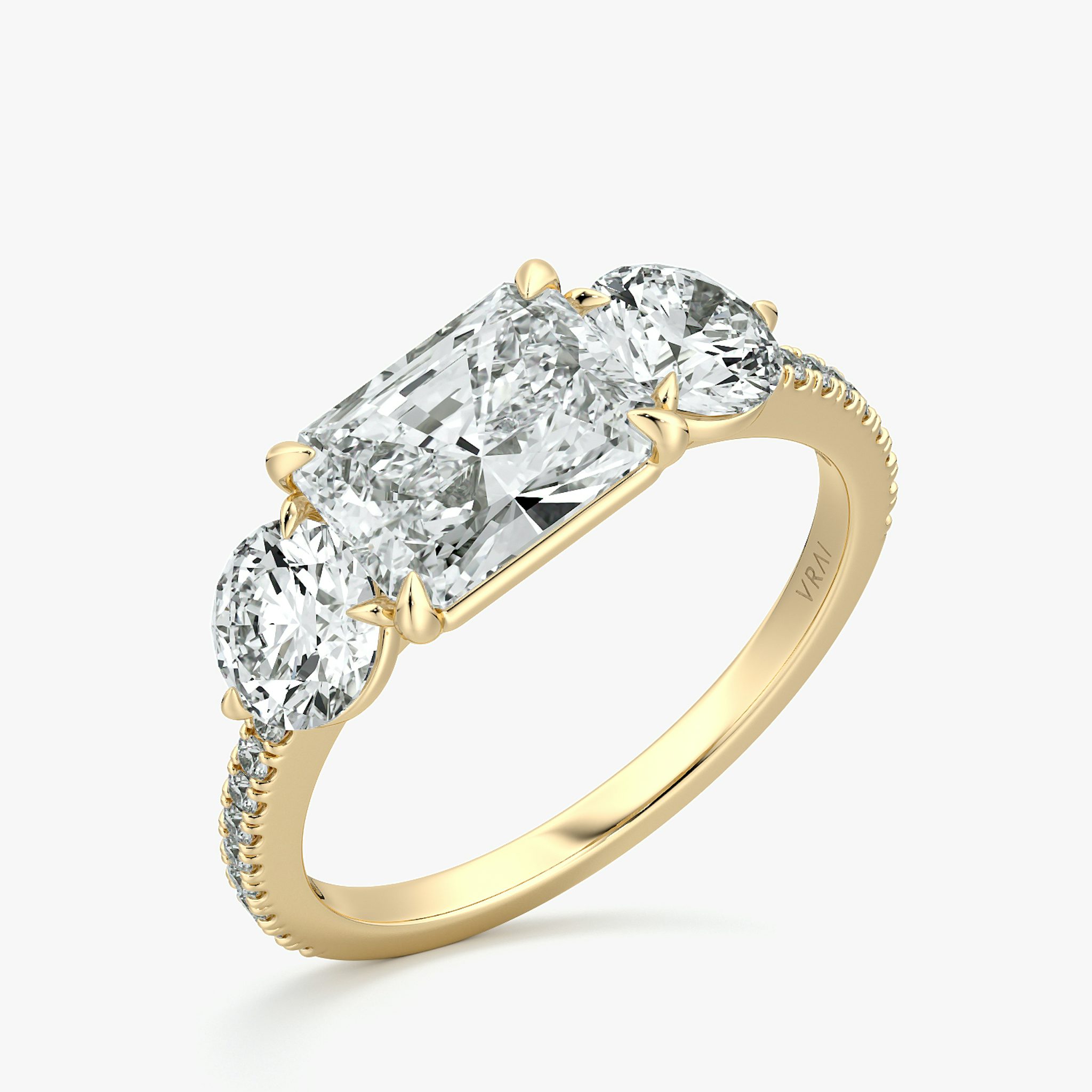 The Three Stone | Radiant | 18k | Yellow Gold | bandAccent: Pavé | diamondOrientation: horizontal | sideStoneCarat: 0.50ct | sideStoneShape: Round Brilliant | caratWeight: other
