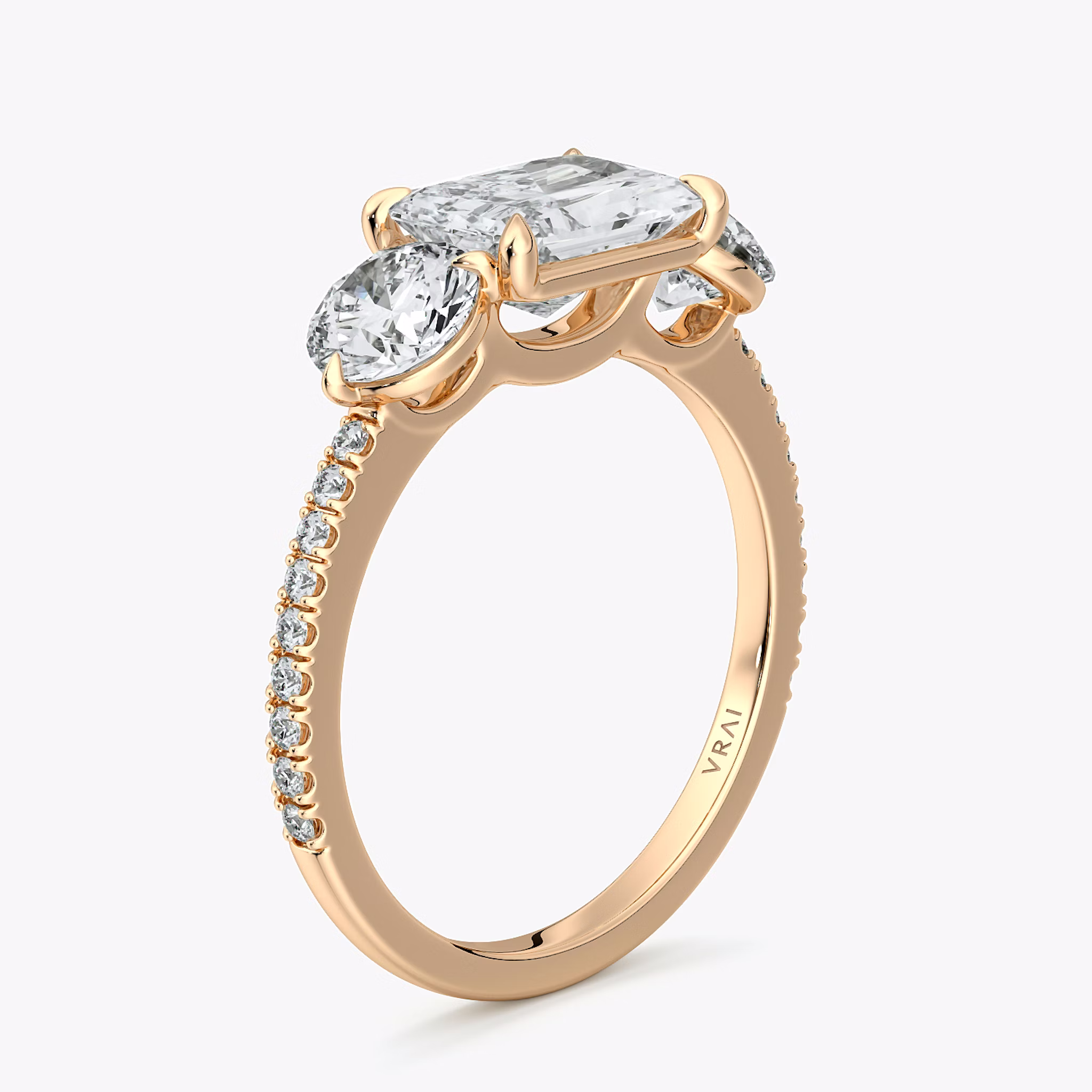 The Three Stone | Radiant | 14k | Rose Gold | bandAccent: Pavé | diamondOrientation: horizontal | sideStoneCarat: 0.50ct | sideStoneShape: Round Brilliant | caratWeight: other