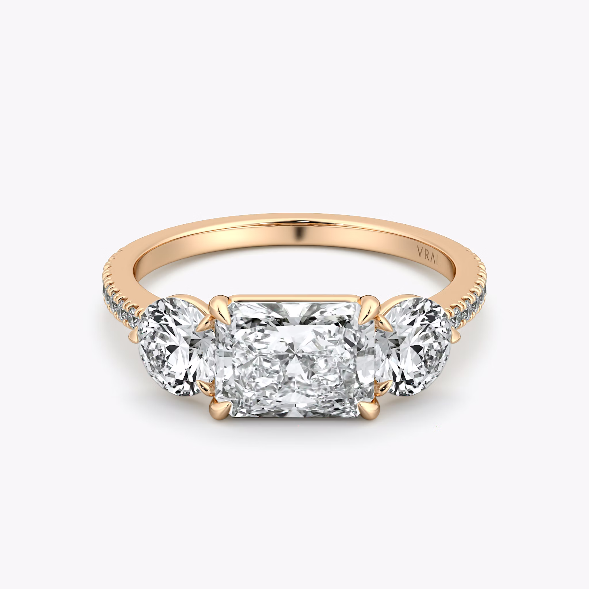 The Three Stone | Radiant | 14k | Rose Gold | bandAccent: Pavé | diamondOrientation: horizontal | sideStoneCarat: 0.50ct | sideStoneShape: Round Brilliant | caratWeight: other