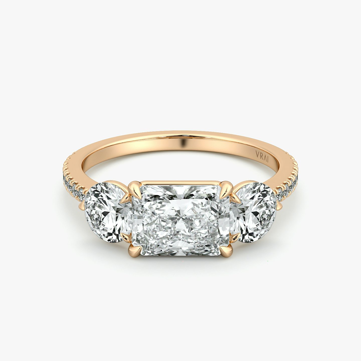 The Three Stone | Radiant | 14k | Rose Gold | bandAccent: Pavé | diamondOrientation: horizontal | sideStoneCarat: 0.50ct | sideStoneShape: Round Brilliant | caratWeight: other