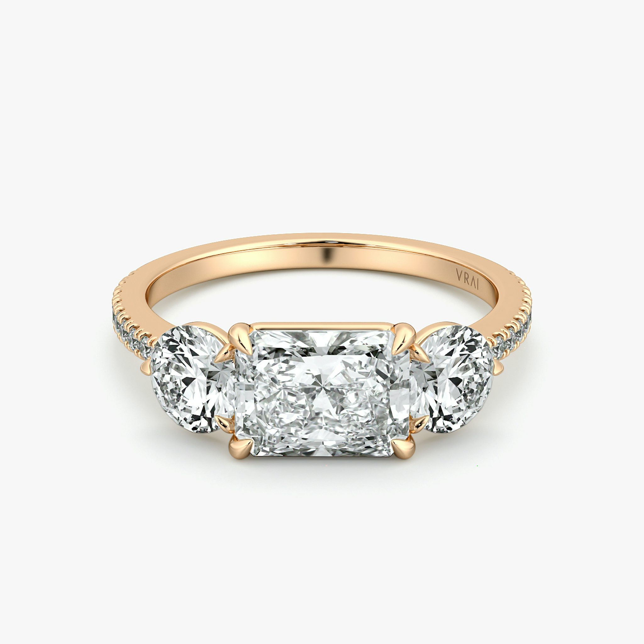 The Three Stone | Radiant | 14k | Rose Gold | bandAccent: Pavé | diamondOrientation: horizontal | sideStoneCarat: 0.50ct | sideStoneShape: Round Brilliant | caratWeight: other