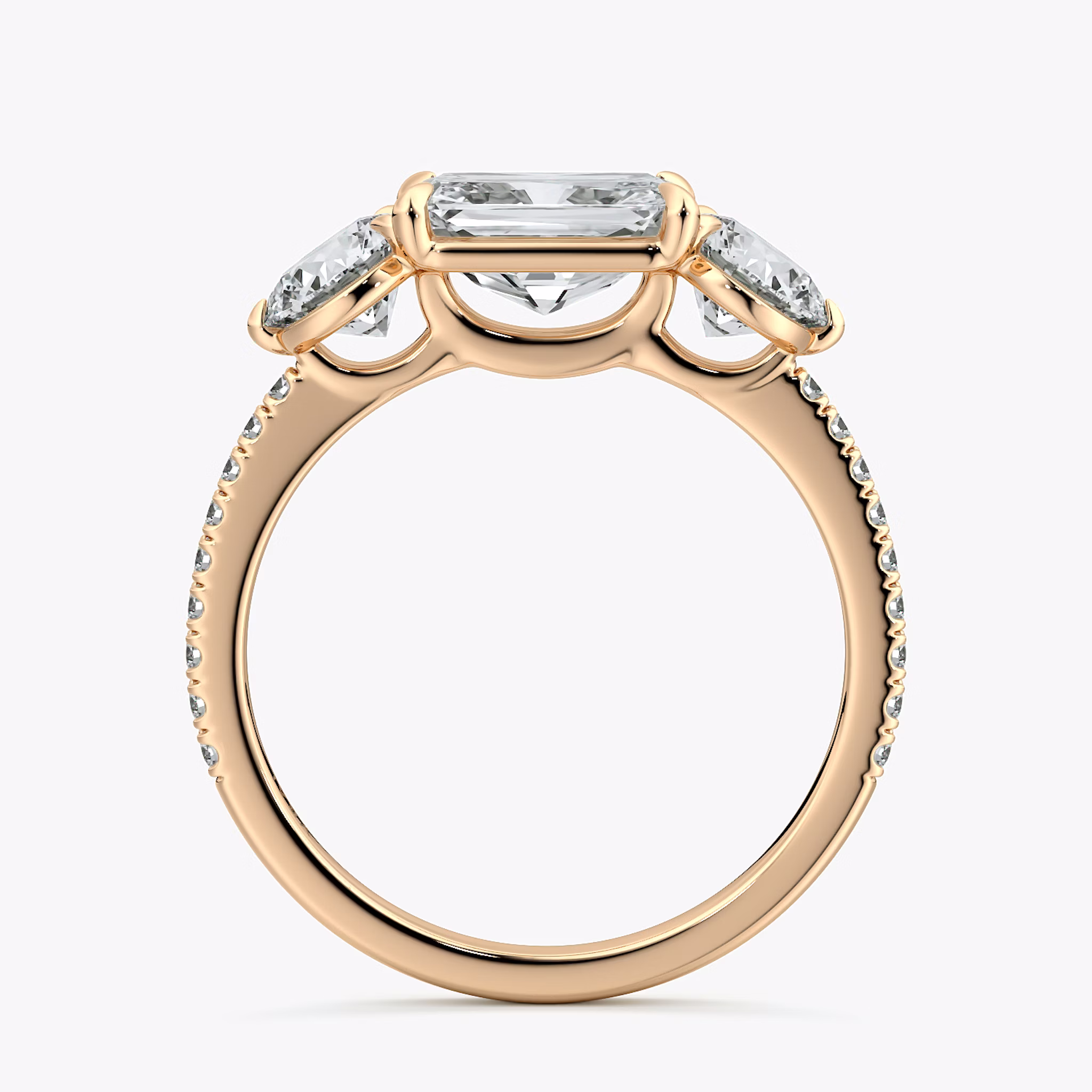 The Three Stone | Radiant | 14k | Rose Gold | bandAccent: Pavé | diamondOrientation: horizontal | sideStoneCarat: 0.50ct | sideStoneShape: Round Brilliant | caratWeight: other