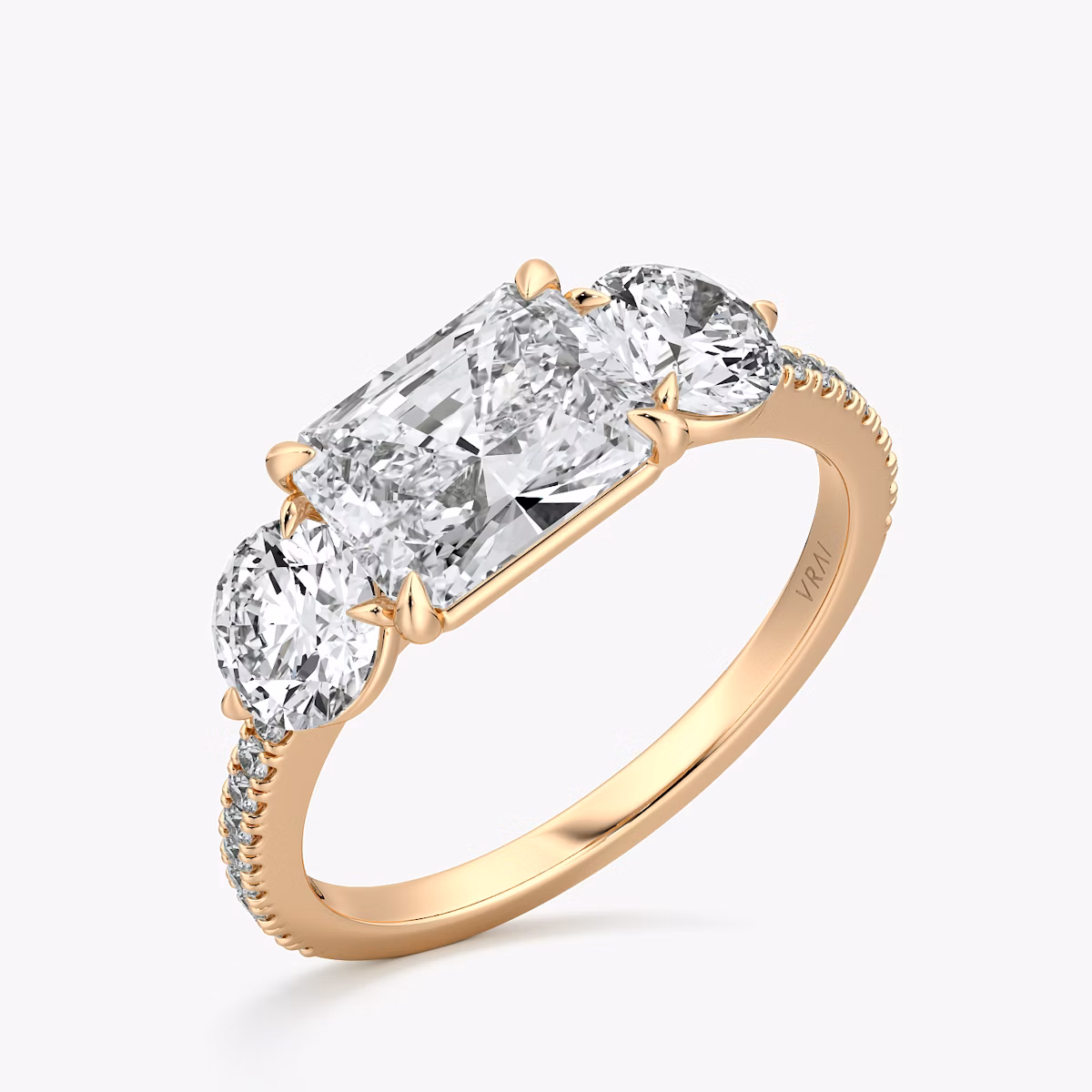 The Three Stone | Radiant | 14k | Rose Gold | bandAccent: Pavé | diamondOrientation: horizontal | sideStoneCarat: 0.50ct | sideStoneShape: Round Brilliant | caratWeight: other