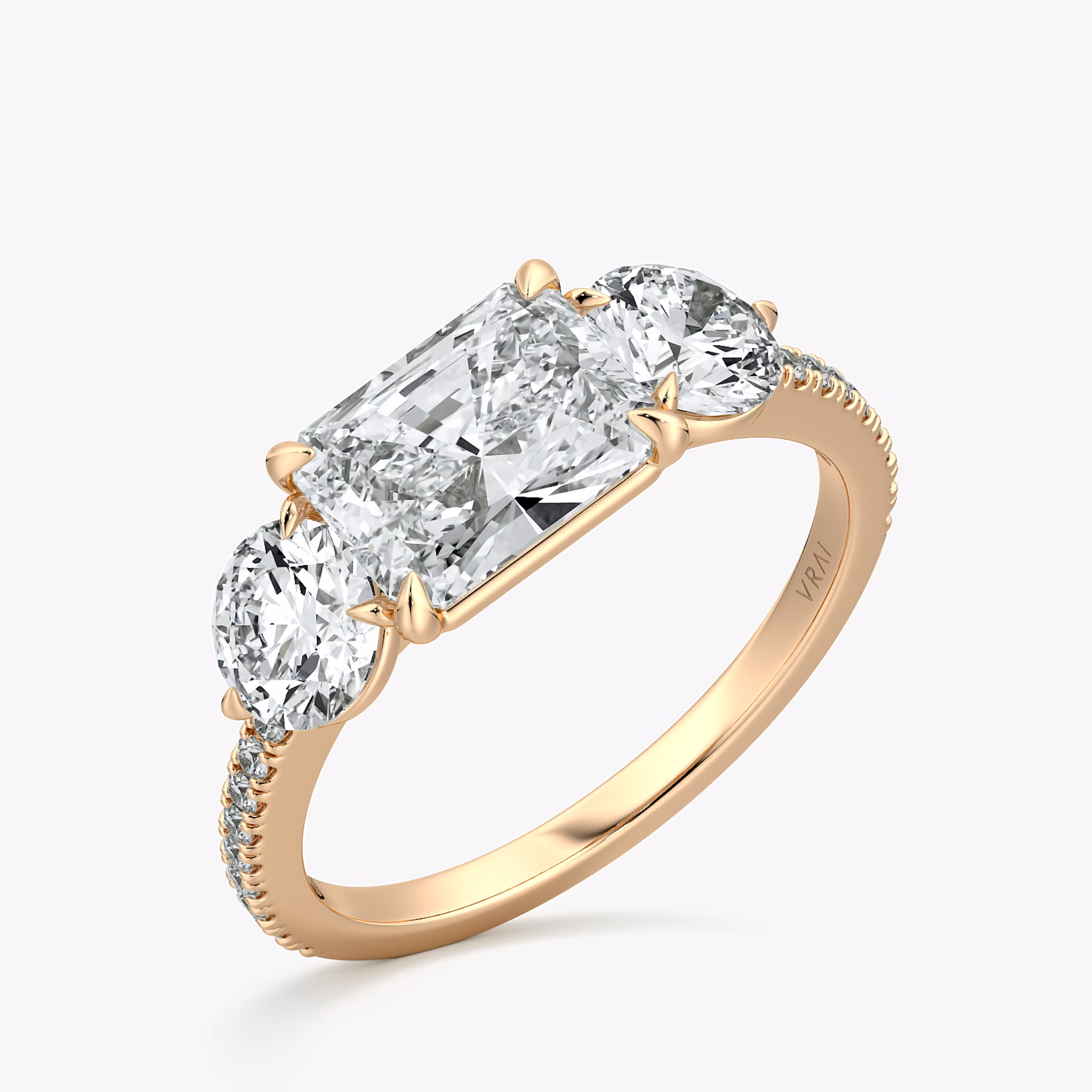 The Three Stone | Radiant | 14k | Rose Gold | bandAccent: Pavé | diamondOrientation: horizontal | sideStoneCarat: 0.50ct | sideStoneShape: Round Brilliant | caratWeight: other