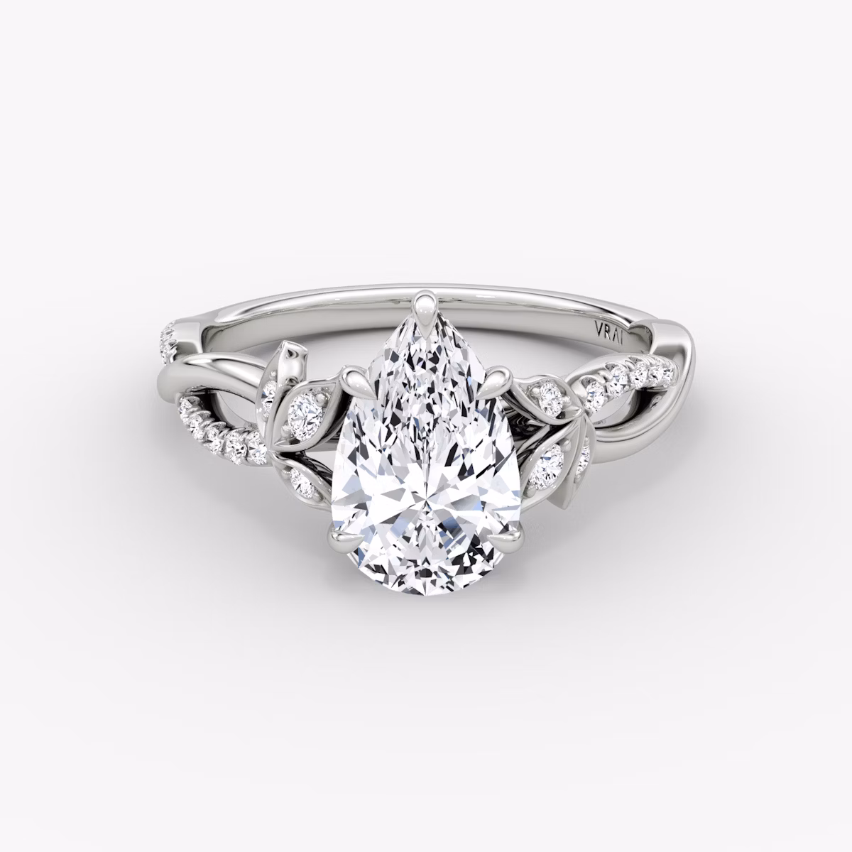 Front view of the twisted floral pear white gold engagement ring
