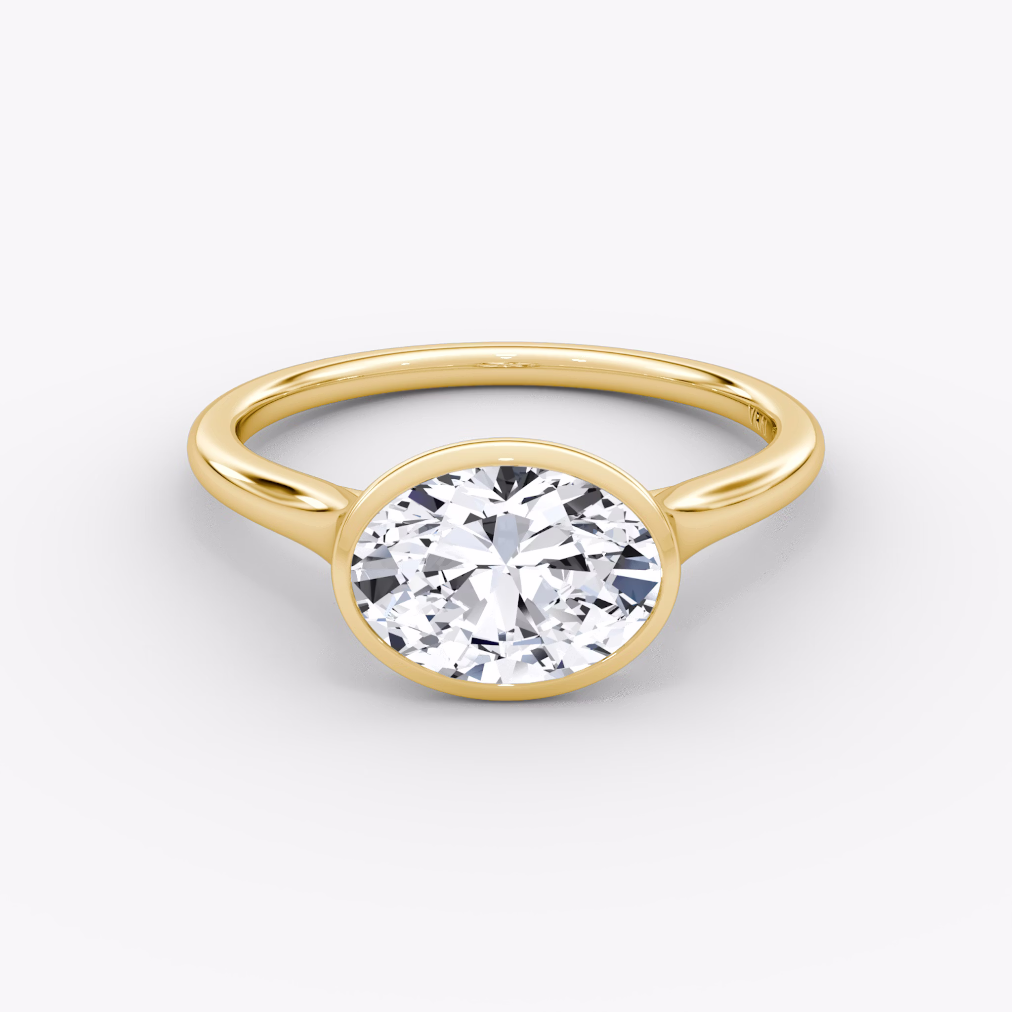 A gold VRAI created Bezel diamond ring.