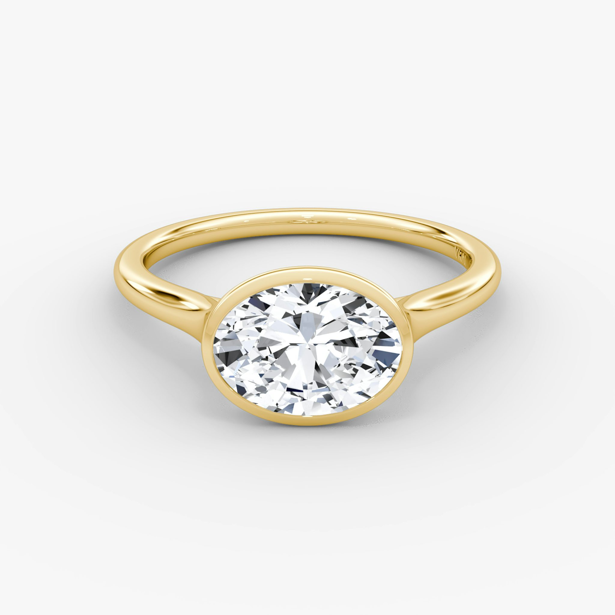 A gold VRAI created Bezel diamond ring.