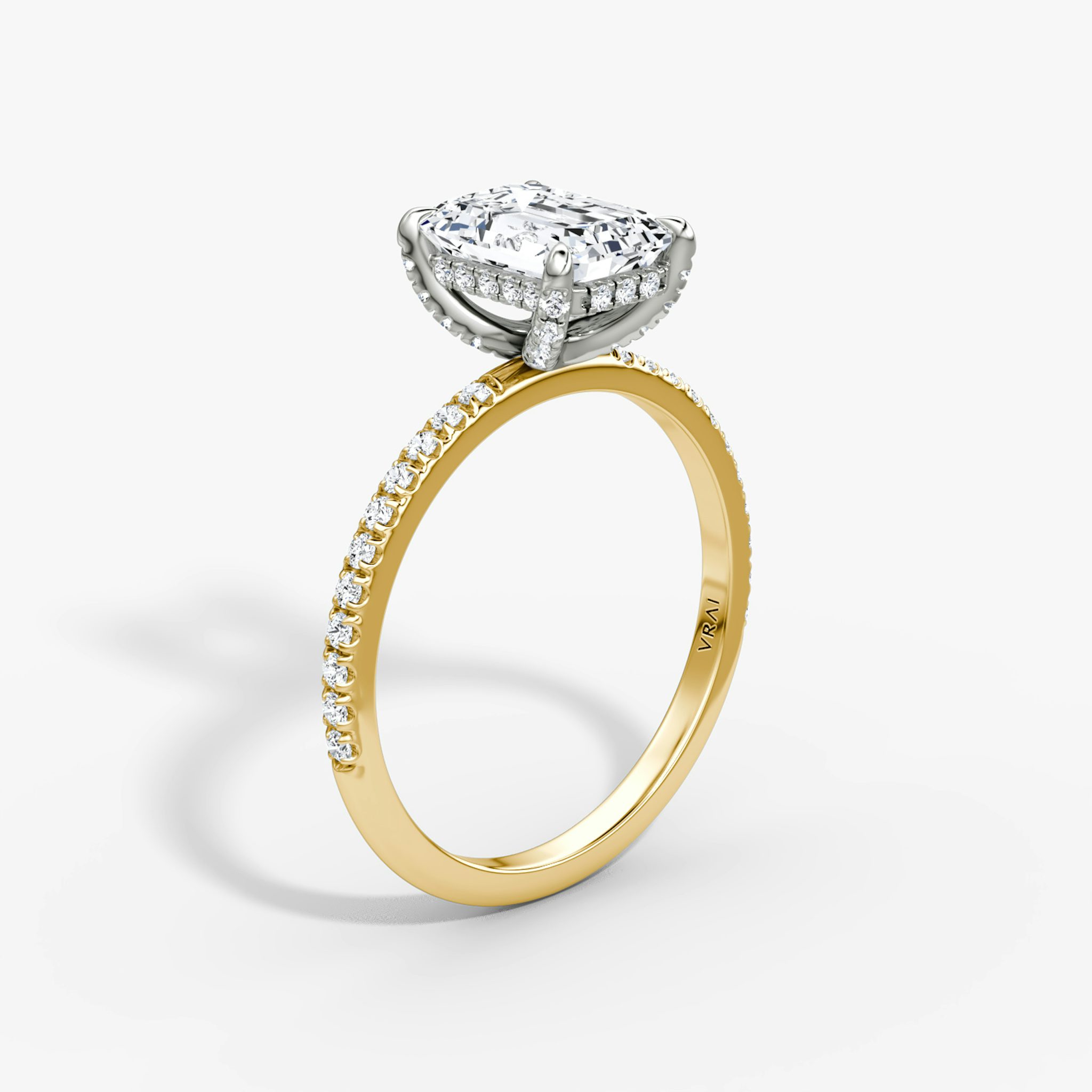 The Classic Hidden Halo | Emerald | 18k | Yellow Gold and Platinum | bandAccent: Pavé | bandWidth: standard | prongStyle: Pavé | diamondOrientation: vertical | caratWeight: other
