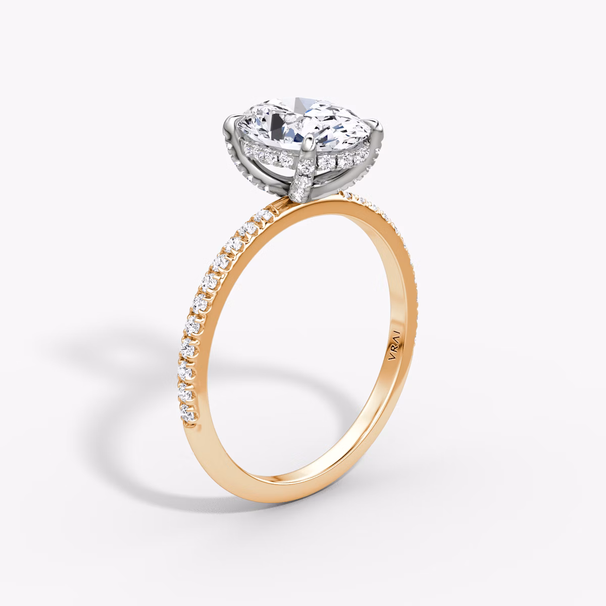 The Classic Hidden Halo | Oval | 14k | Rose Gold and Platinum | bandAccent: Pavé | bandWidth: standard | prongStyle: Pavé | diamondOrientation: vertical | caratWeight: other