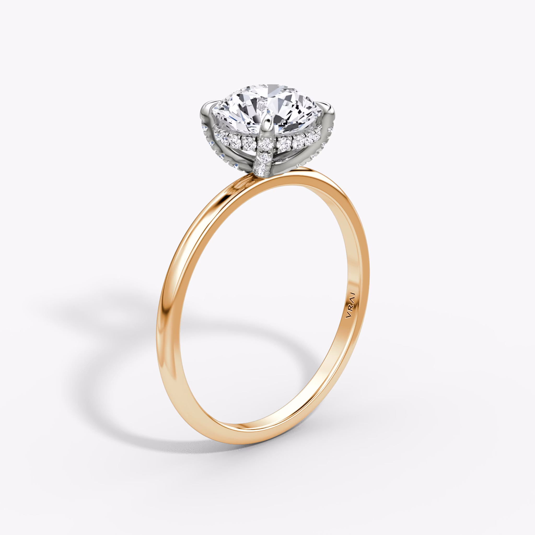 The Classic Hidden Halo | Round Brilliant | 14k | Rose Gold and Platinum | bandAccent: Plain | bandWidth: standard | caratWeight: 1.5ct | prongStyle: Pavé | diamondOrientation: vertical