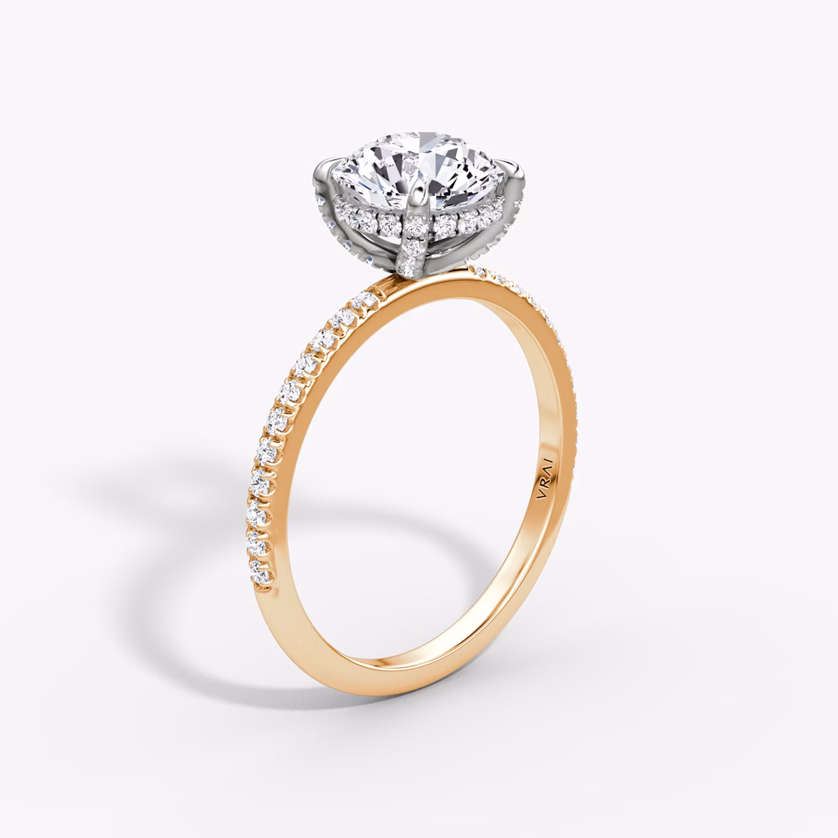 The Classic Hidden Halo | Round Brilliant | 14k | Rose Gold and Platinum | bandAccent: Pavé | bandWidth: standard | caratWeight: 1.5ct | prongStyle: Pavé | diamondOrientation: vertical