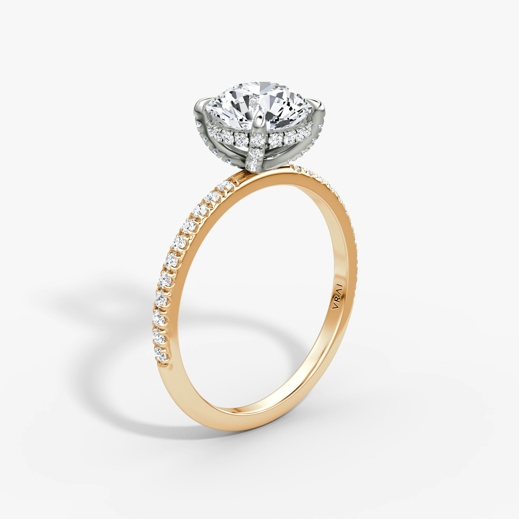 The Classic Hidden Halo | Round Brilliant | 14k | Rose Gold and Platinum | bandAccent: Pavé | bandWidth: standard | caratWeight: 1.5ct | prongStyle: Pavé | diamondOrientation: vertical