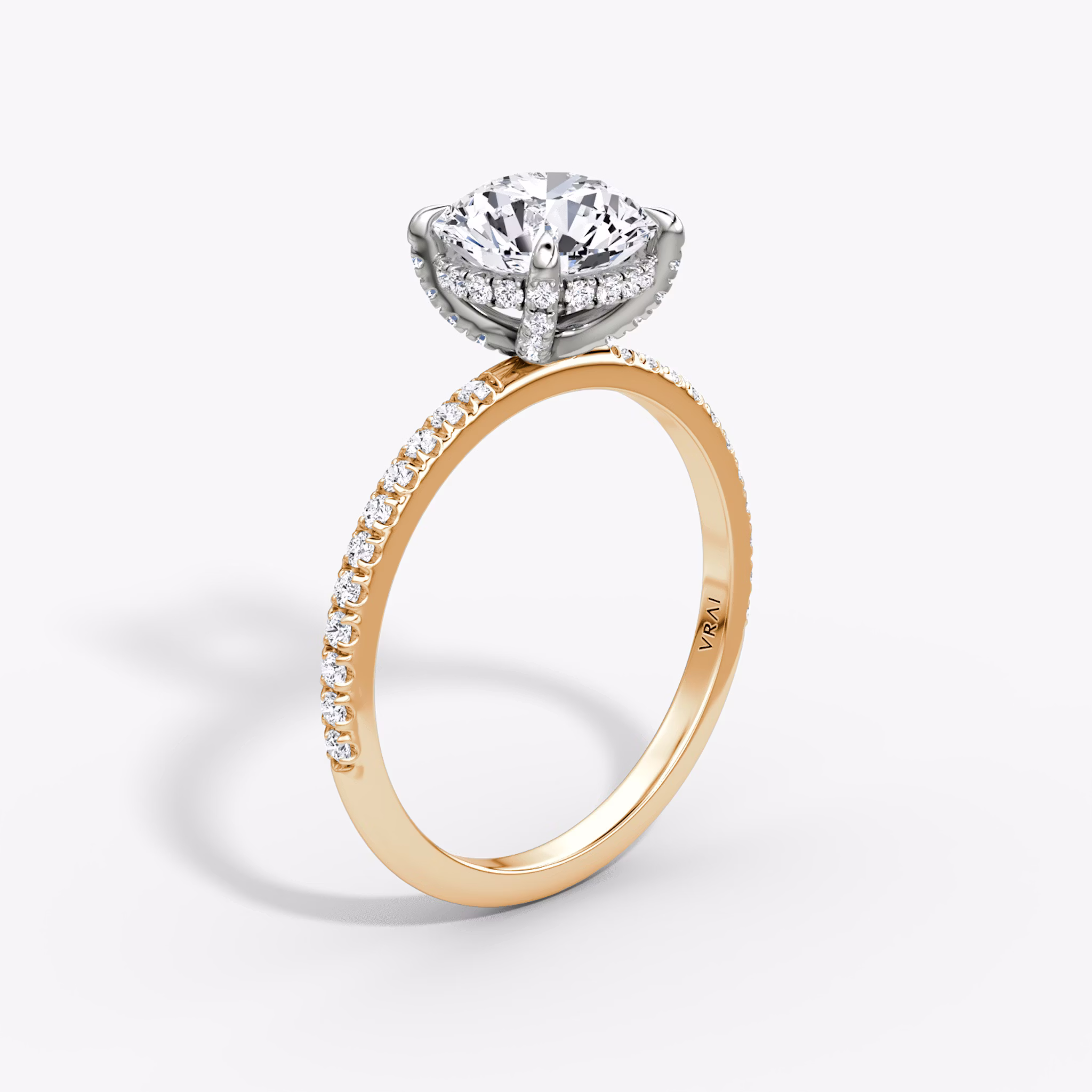 The Classic Hidden Halo | Round Brilliant | 14k | Rose Gold and Platinum | bandAccent: Pavé | bandWidth: standard | caratWeight: 1.0ct | prongStyle: Pavé | diamondOrientation: vertical