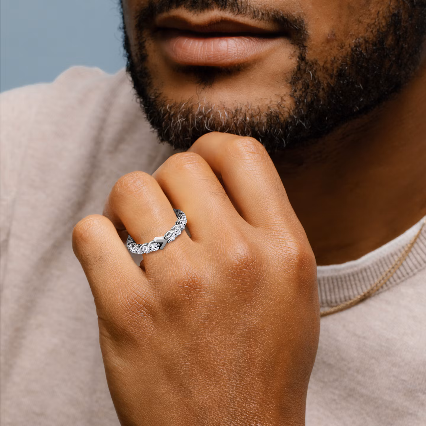 Man wearing a 2ctw white gold V Eternity Band