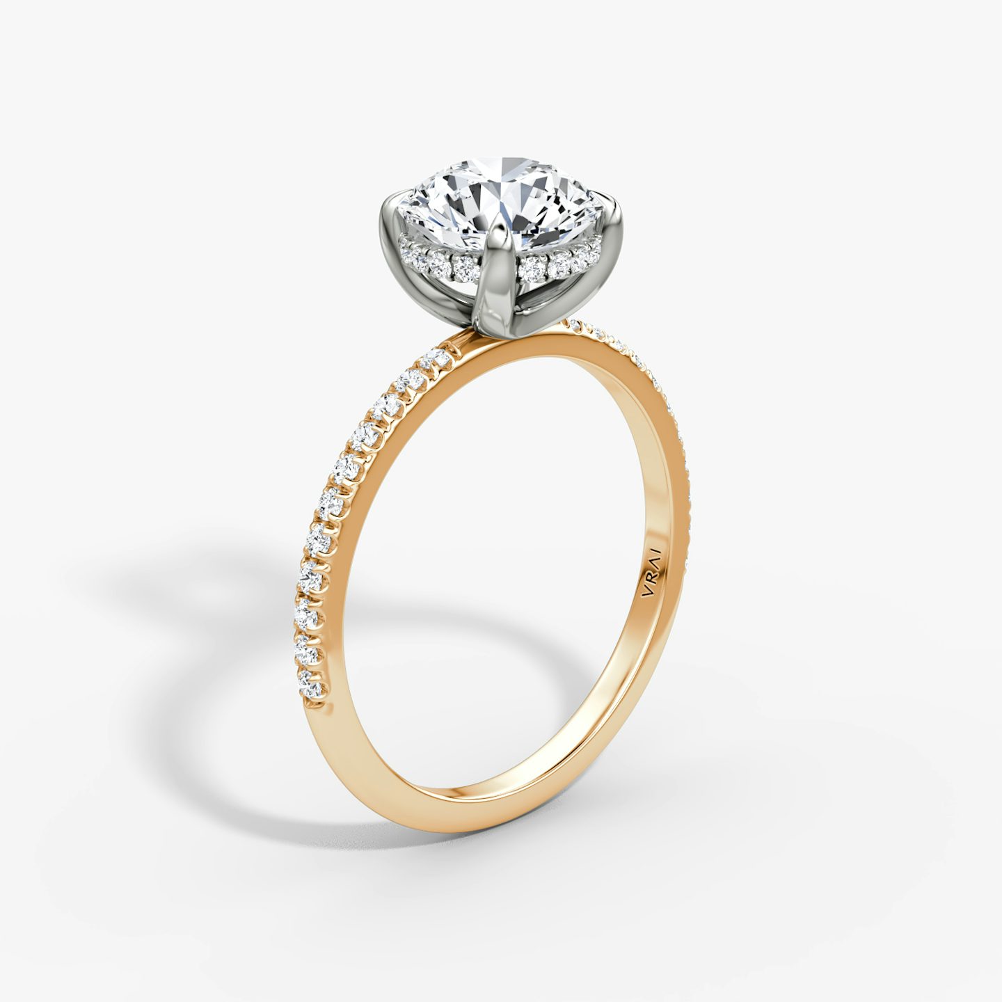 The Classic Hidden Halo | Round Brilliant | 14k | Rose Gold and Platinum | bandAccent: Pavé | bandWidth: standard | caratWeight: 1.5ct | prongStyle: Plain | diamondOrientation: vertical